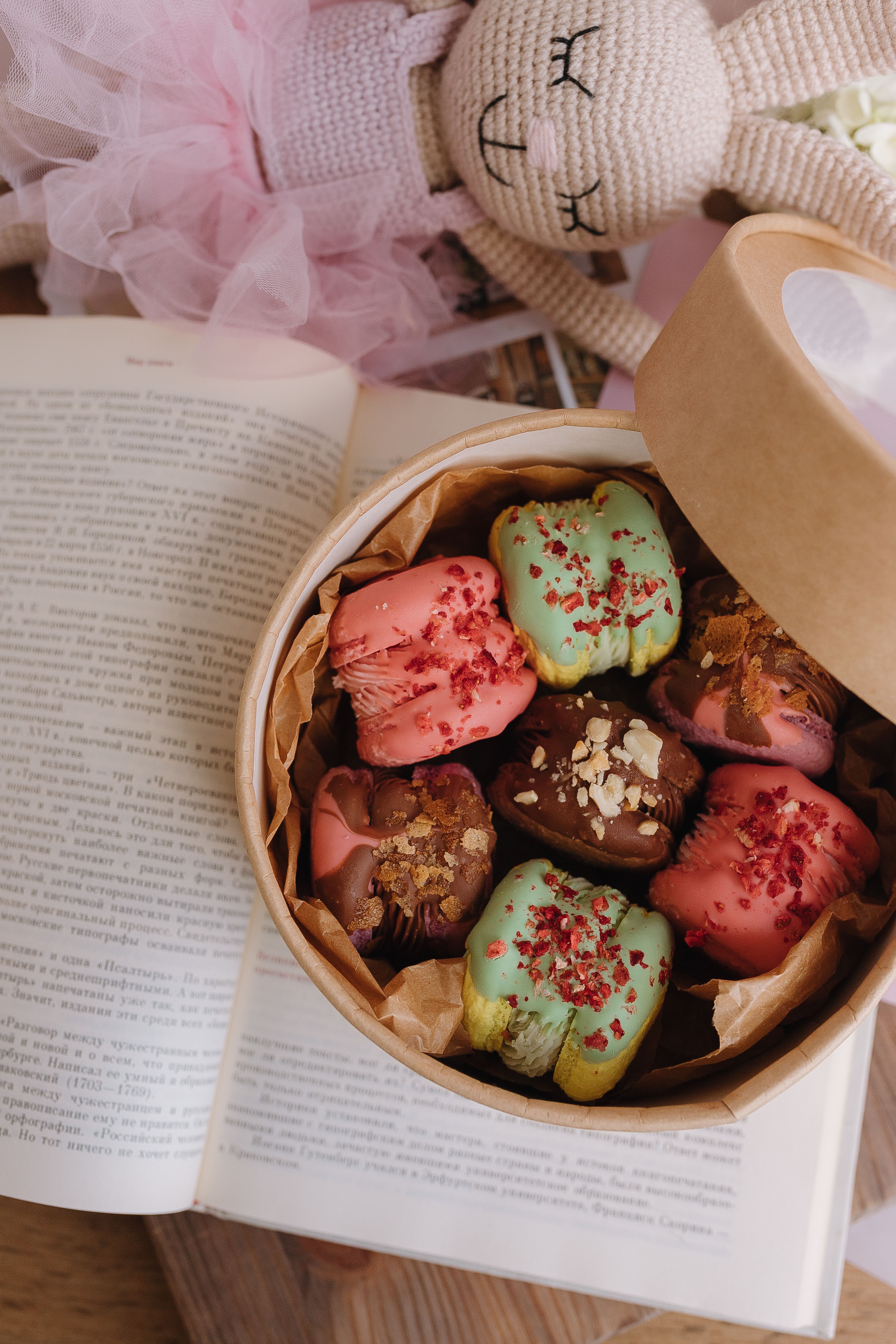 A box of cookies with a book open on top · Free Stock Photo