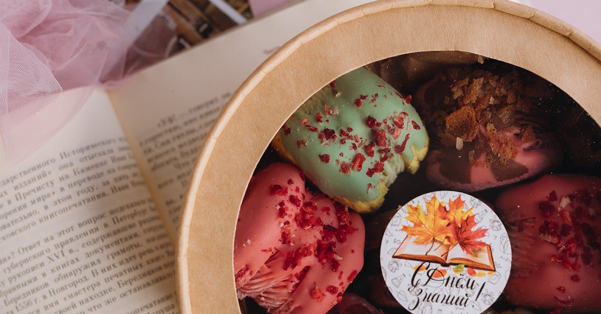 A small wooden box with some colorful cookies