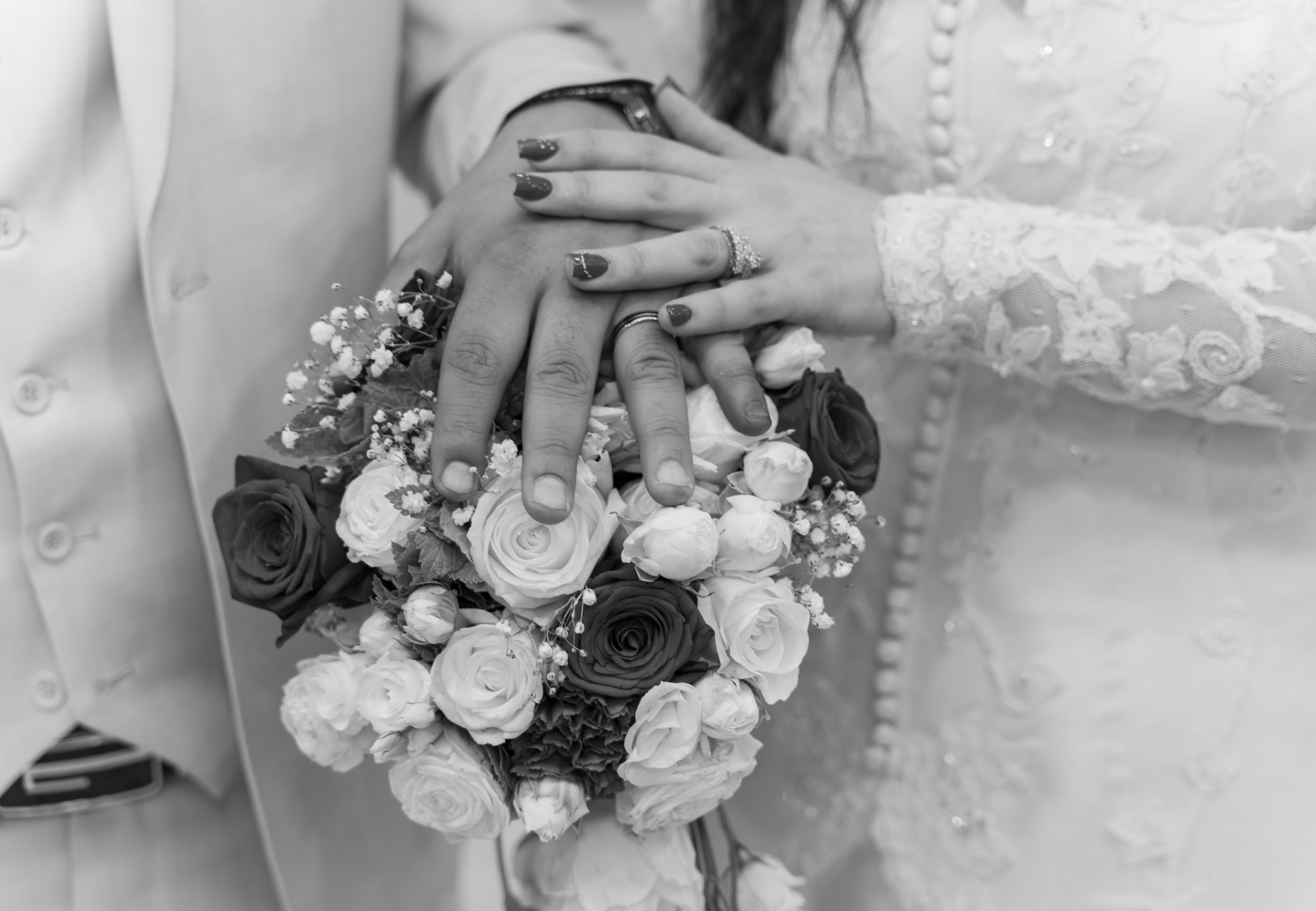 A black and white photo of a bride and groom holding hands · Free Stock ...