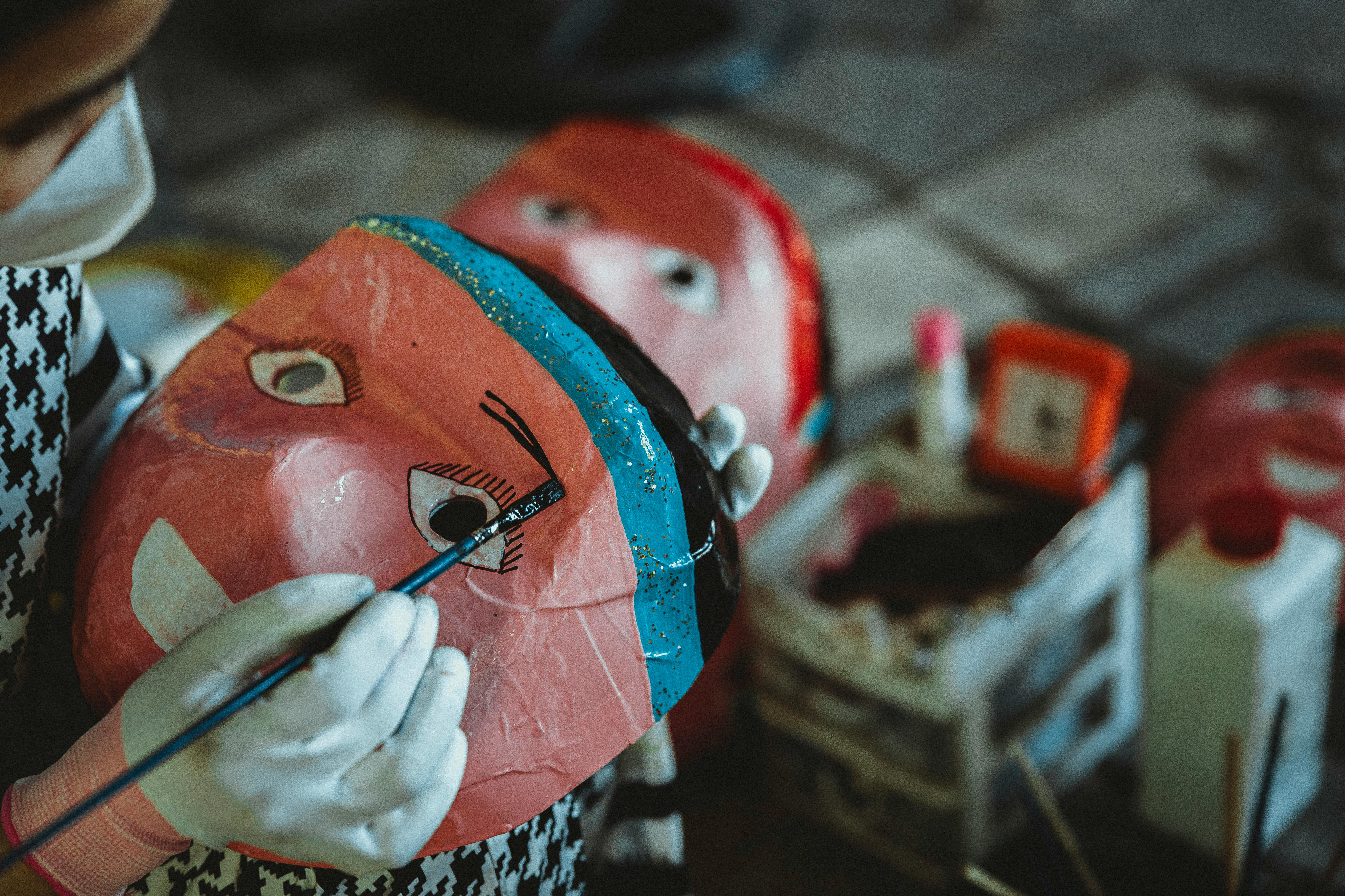 a person is making a mask with a mask