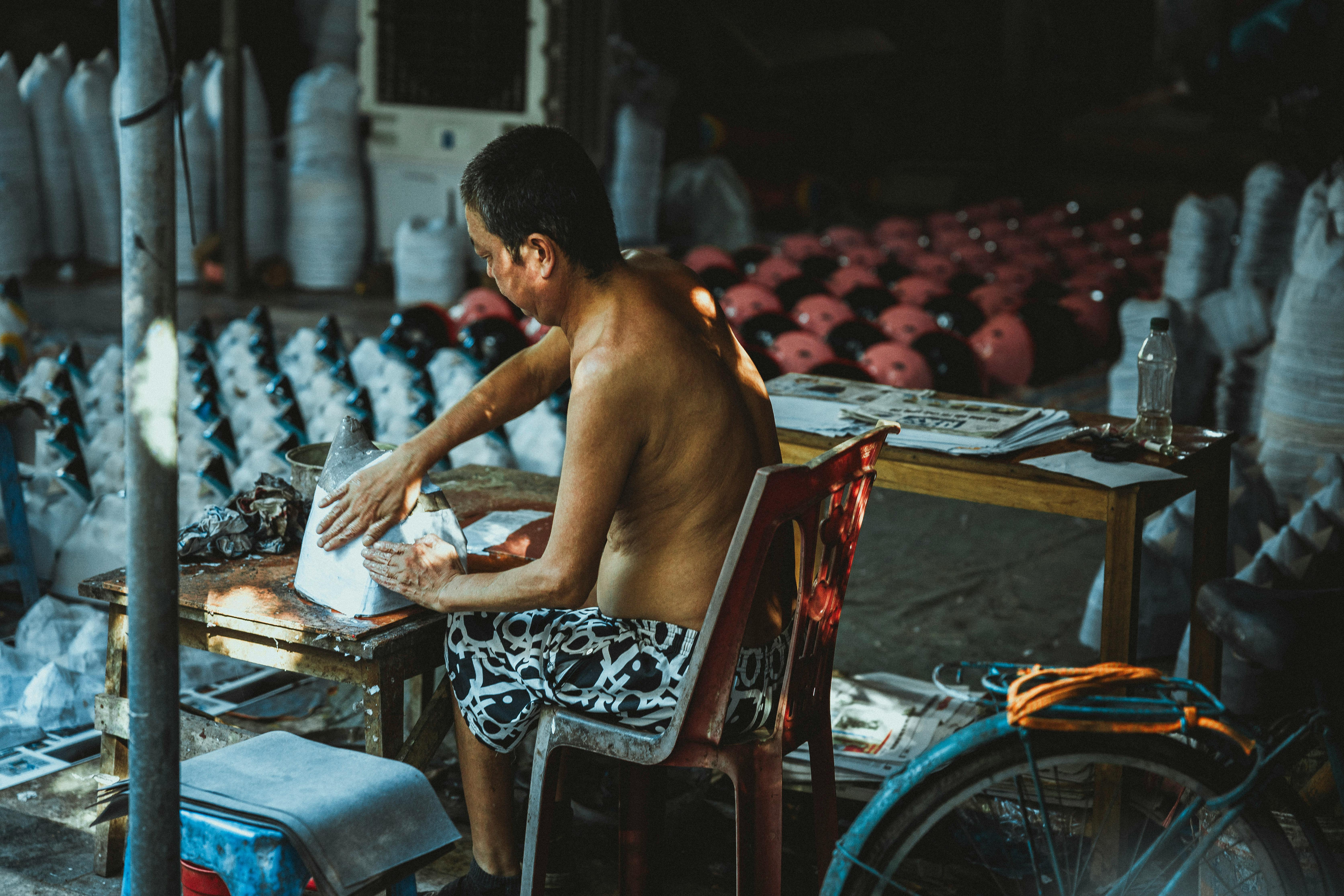 a man is working on a table in a shop