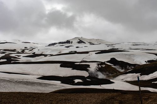 Free A stunning view of Iceland's snow-covered highlands showcasing rugged volcanic terrain. Stock Photo