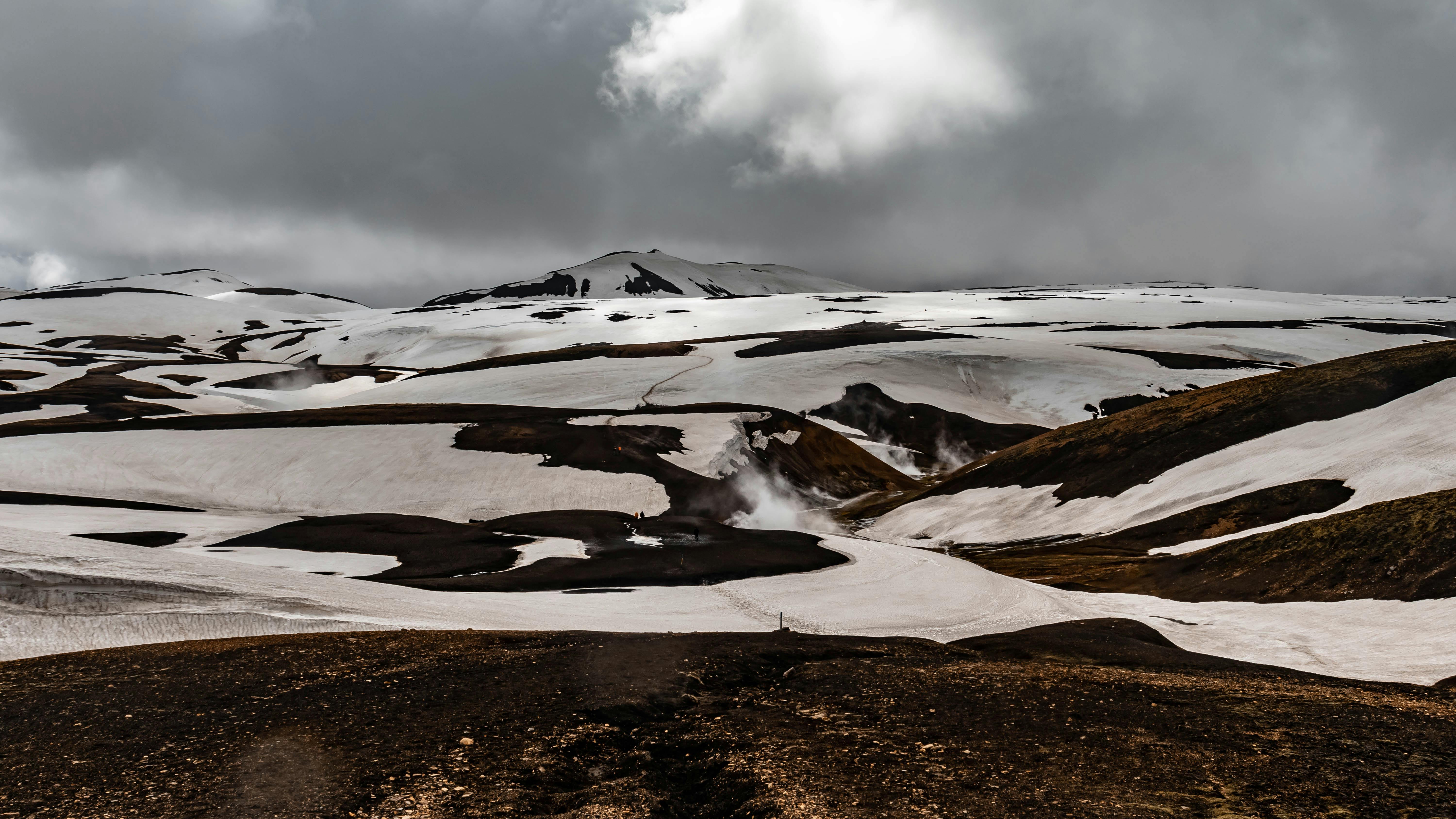 Prescription Goggle Inserts - Breathtaking view of a volcanic landscape with snow in Iceland's Highlands, ideal for adventurers.