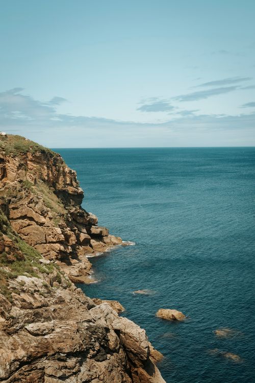 Free Breathtaking view of rocky cliffs and the ocean in Malpica, Spain, highlighting nature's beauty. Stock Photo