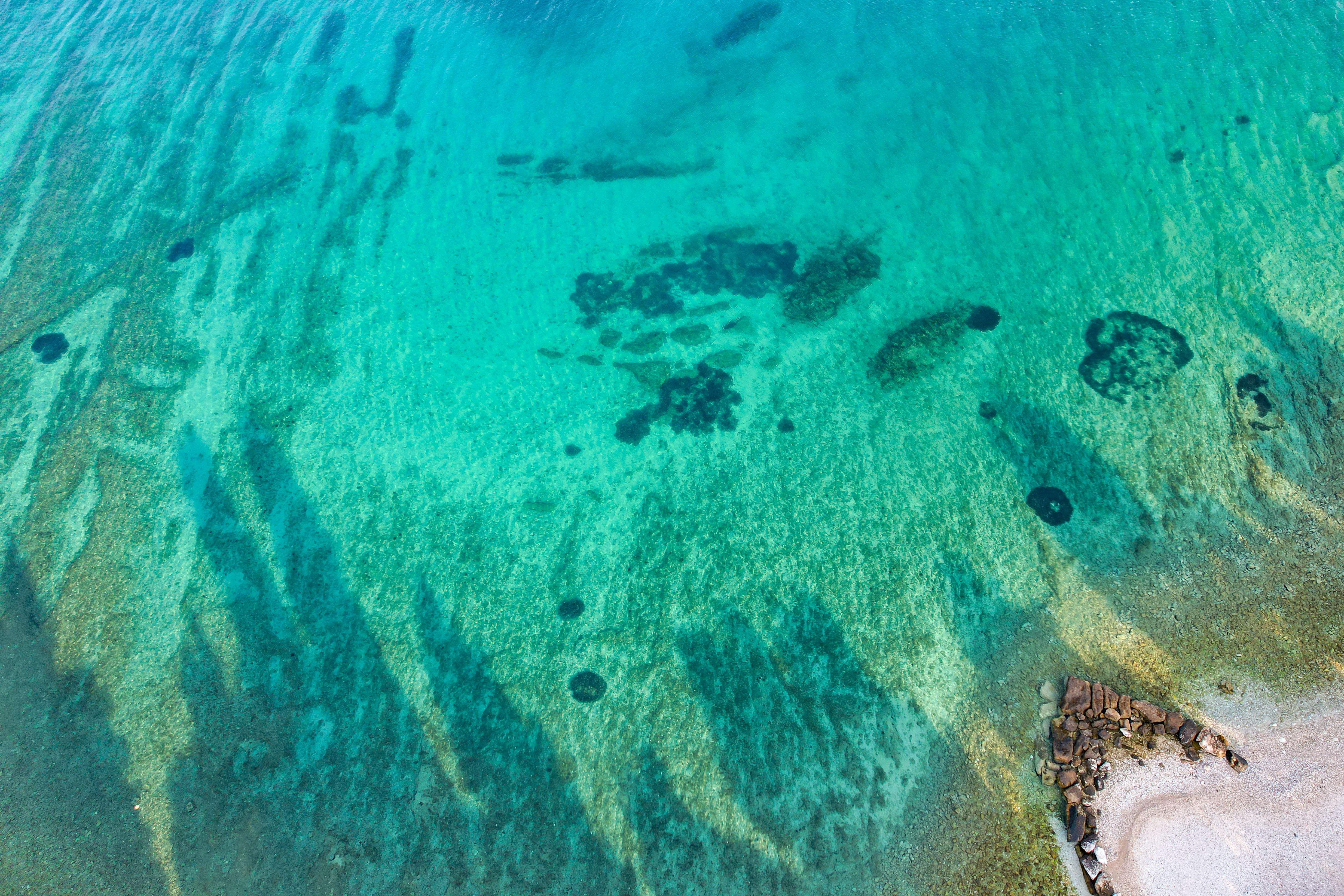Aerial view of the ocean and rocks · Free Stock Photo