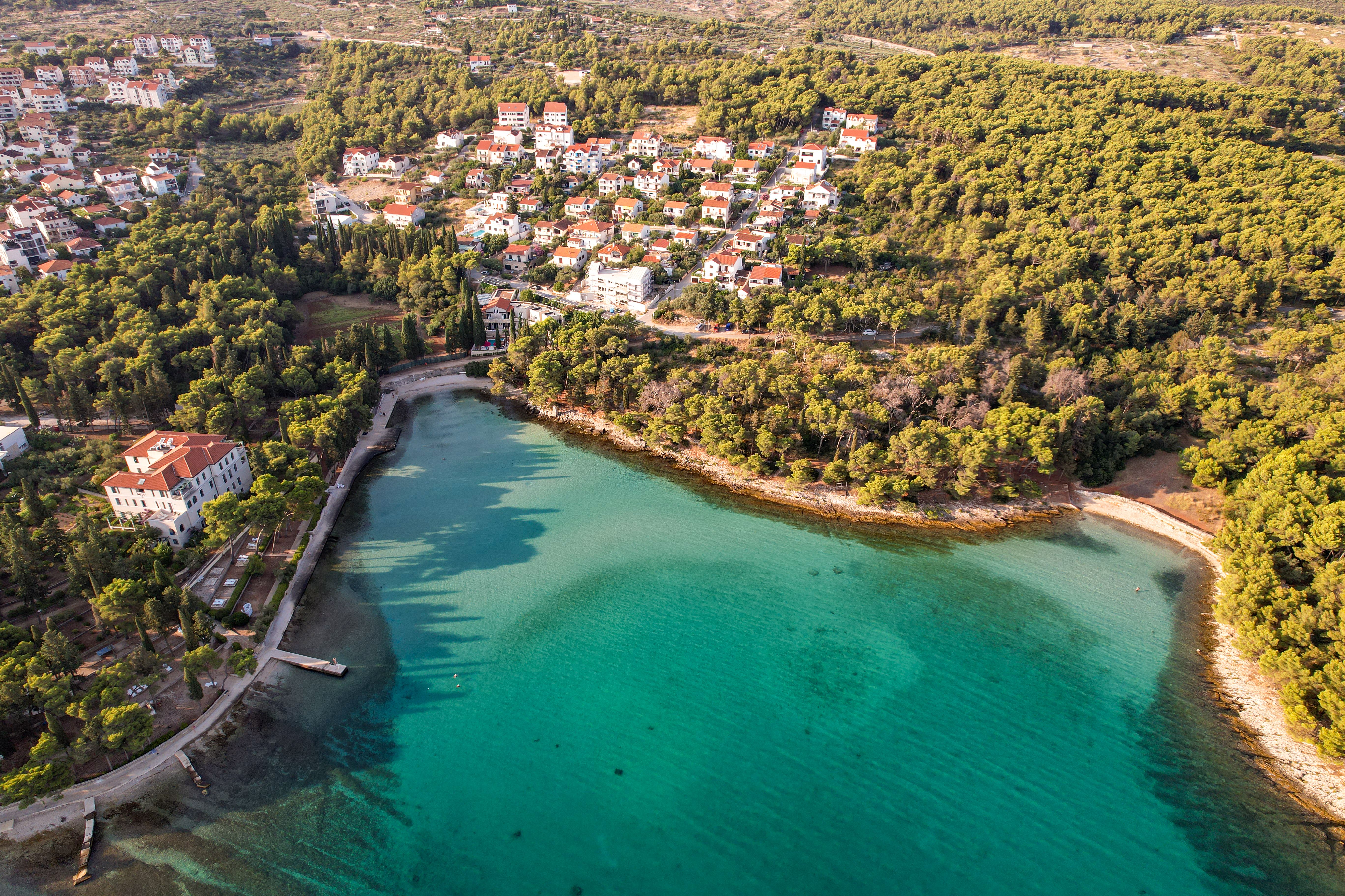 An aerial view of a small town and the water · Free Stock Photo