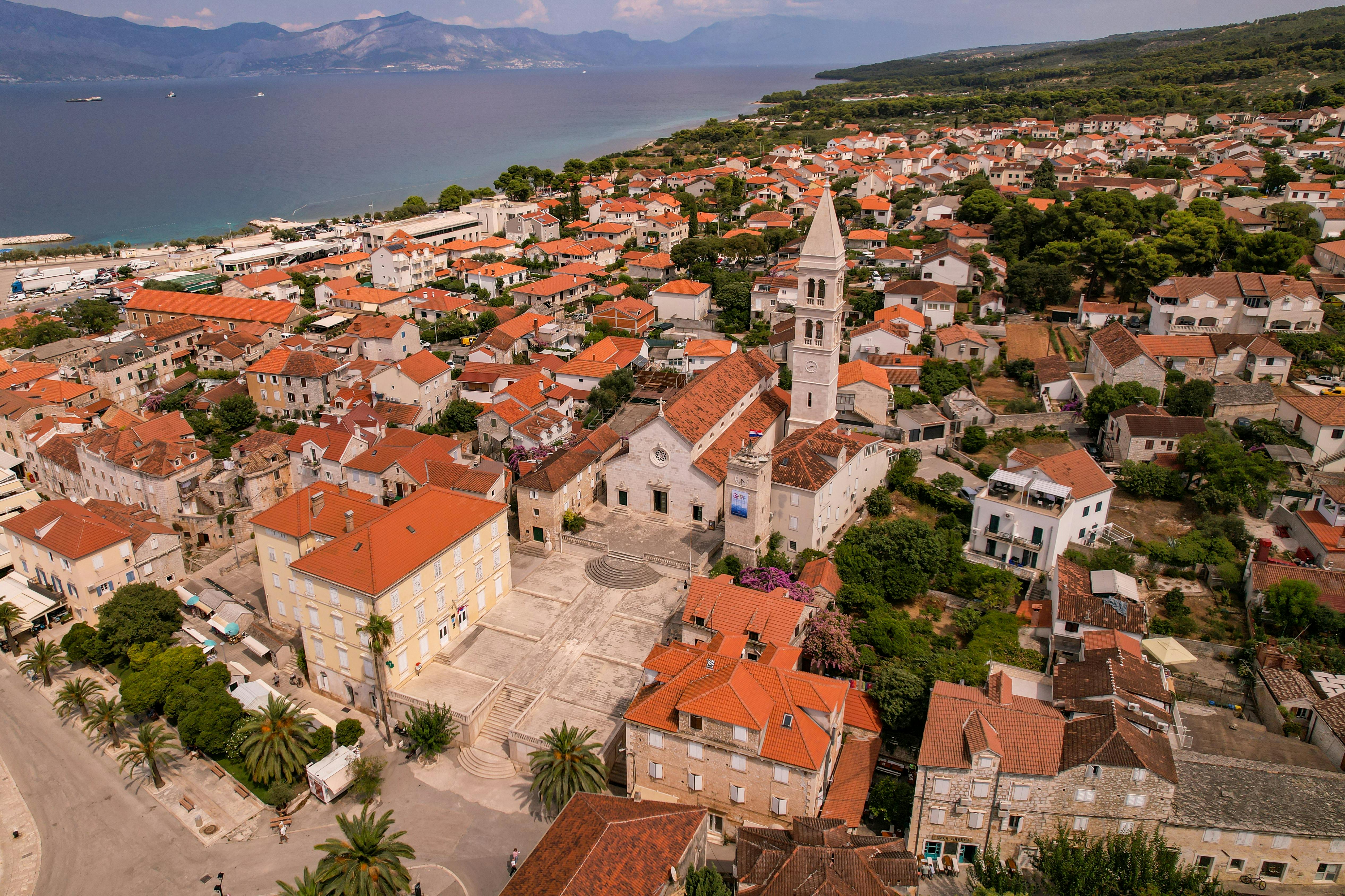 Medieval stone streets and Venetian architecture of Trogir's UNESCO old town with harbor views at golden hour