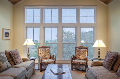 Free Brown Wooden Coffee Table With Couches and Chairs Stock Photo