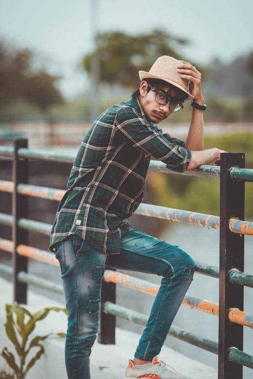 Photo Of Man Leaning On The Fence