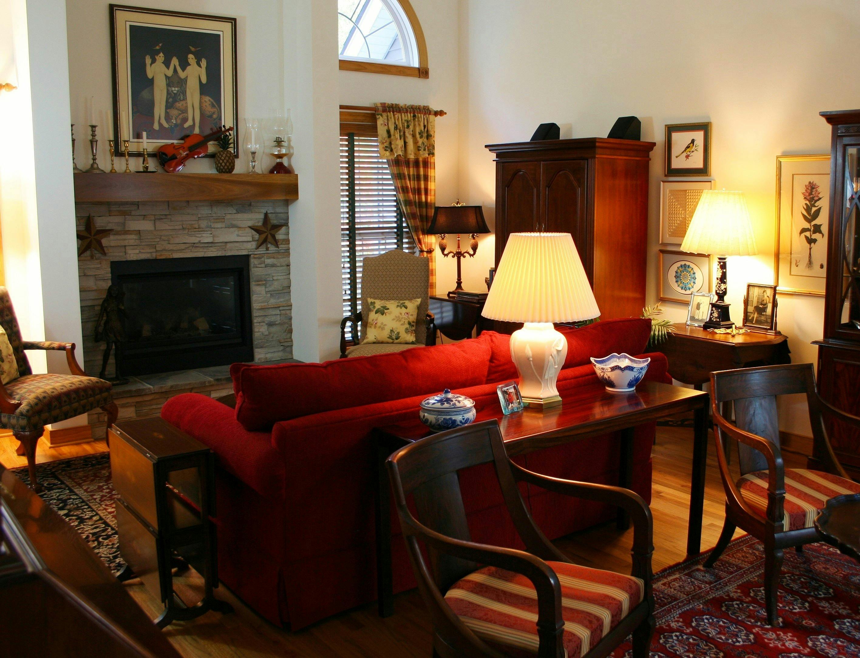 Brown Wooden Console Table Next To Red Loveseat Free Stock Photo