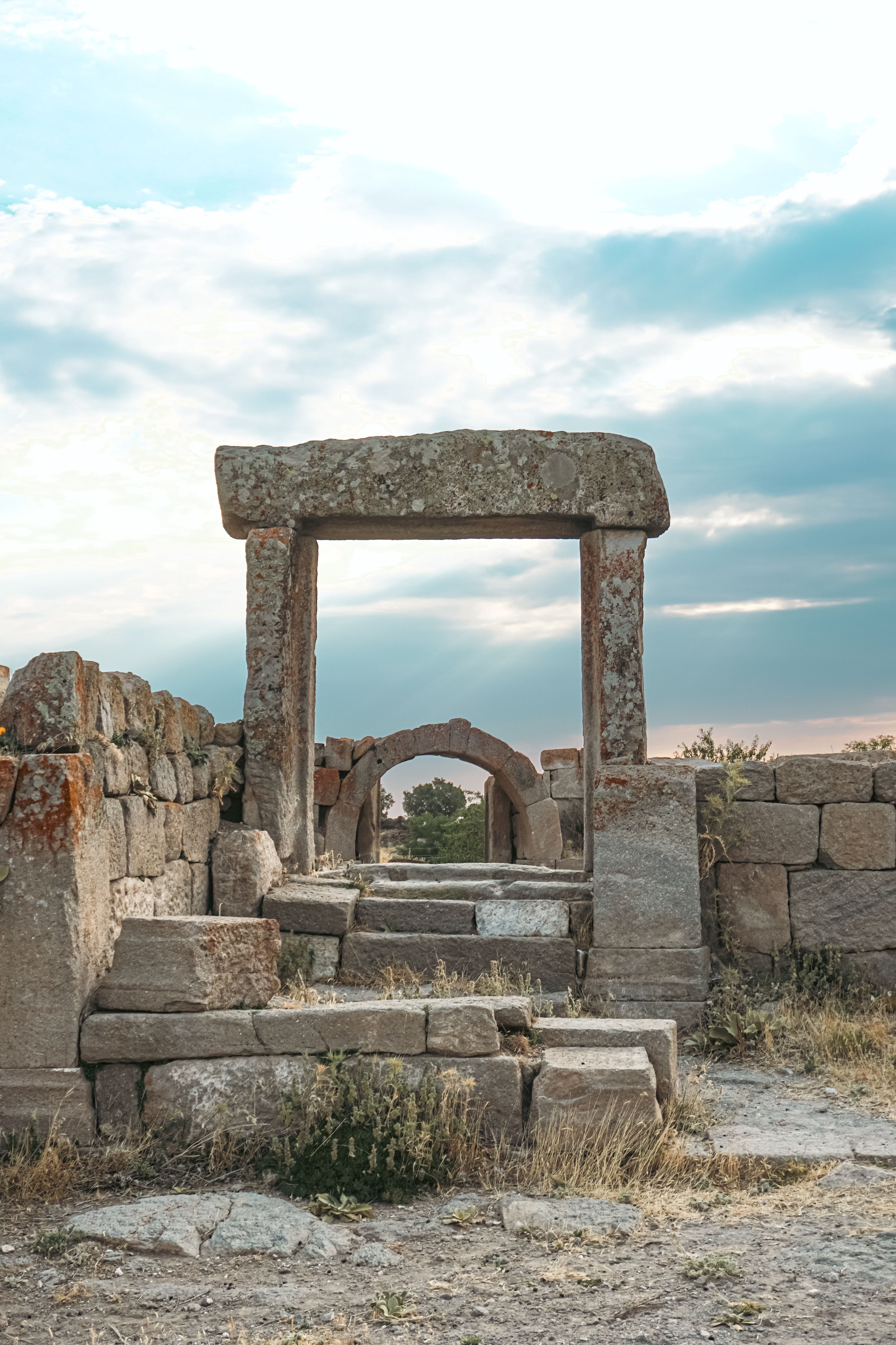 An ancient stone archway in the ruins of a building · Free Stock Photo