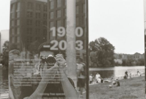 A man taking a picture of himself in front of a mirror