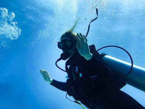 Diver exploring the vibrant underwater world of Puerto Morelos, Mexico.