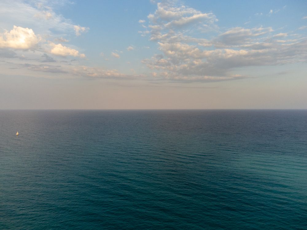 Ocean Flycam View A view of the ocean from a plane · Free Stock Photo