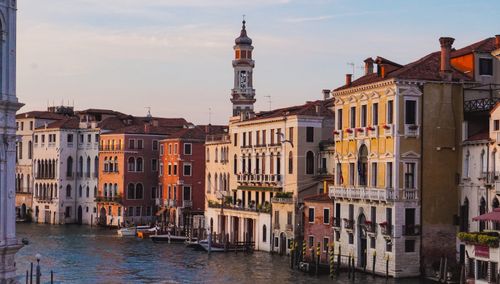 Free Explore the historic Venetian architecture and canals during a picturesque sunset. Stock Photo