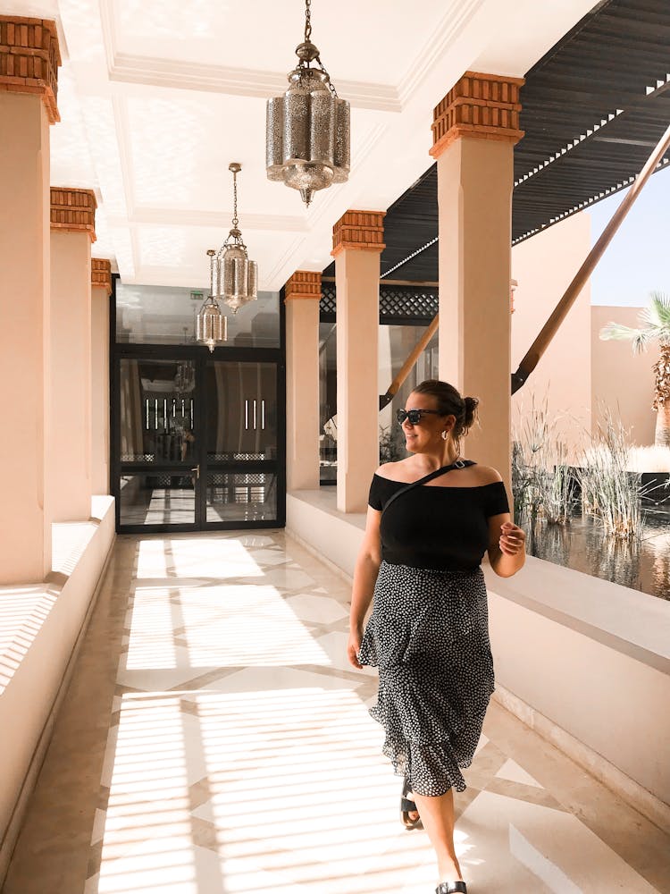 Photo Of Woman Walking In The Hallway