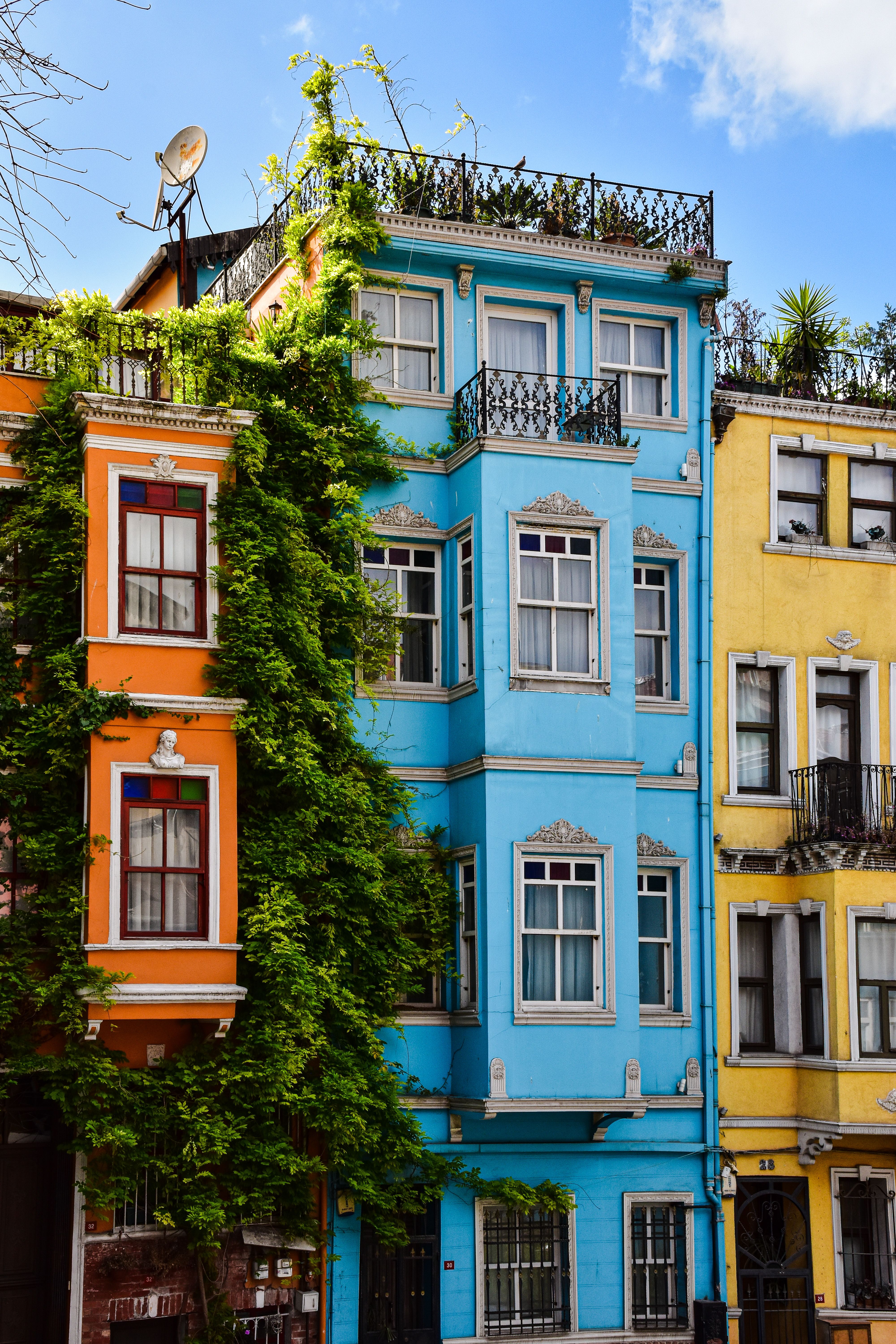 Colorful apartment facades in Istanbul's Balat district showcasing unique architecture and urban charm.