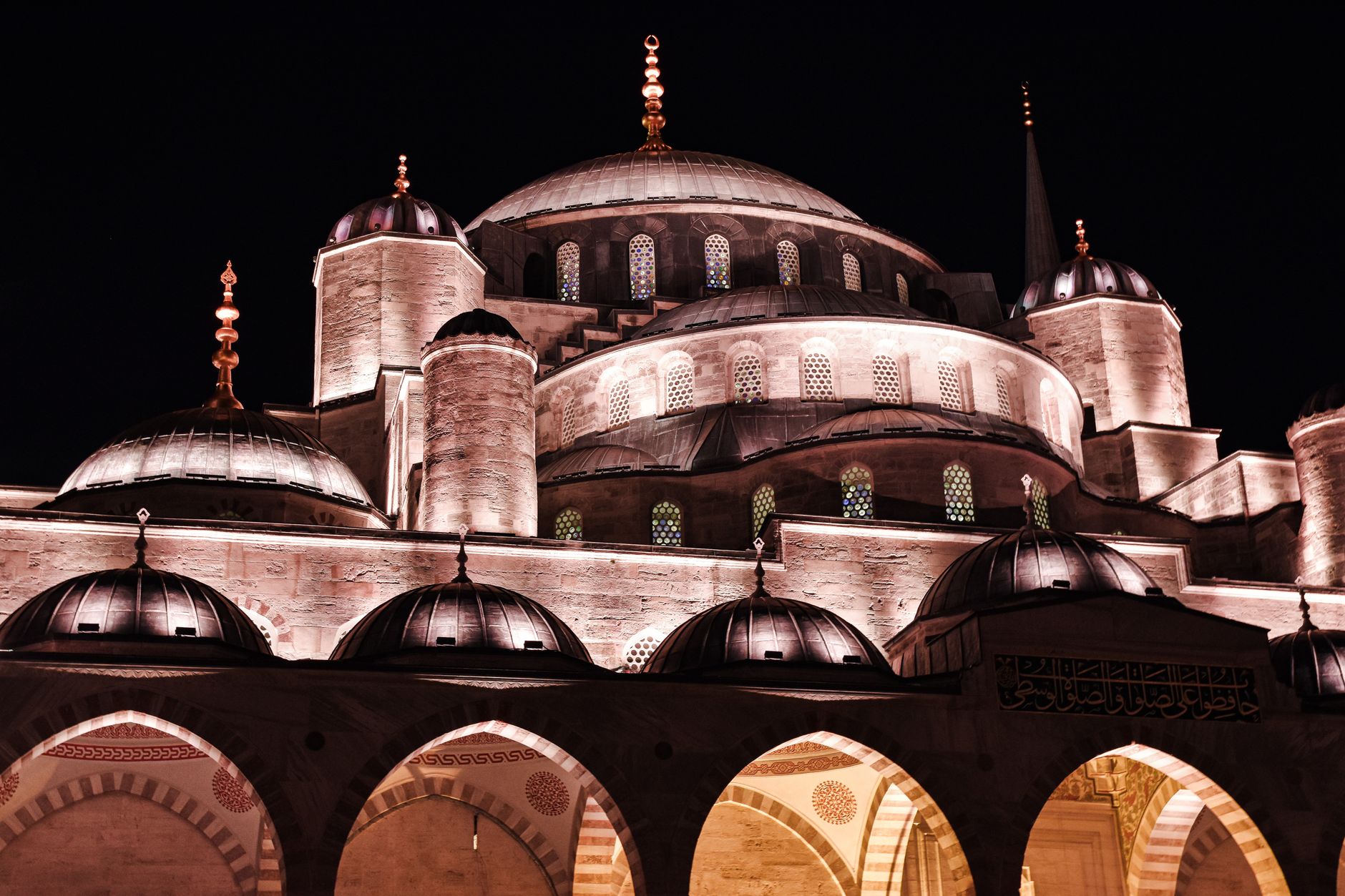 Stunning night view of the illuminated Blue Mosque in Istanbul, showcasing its grandeur.