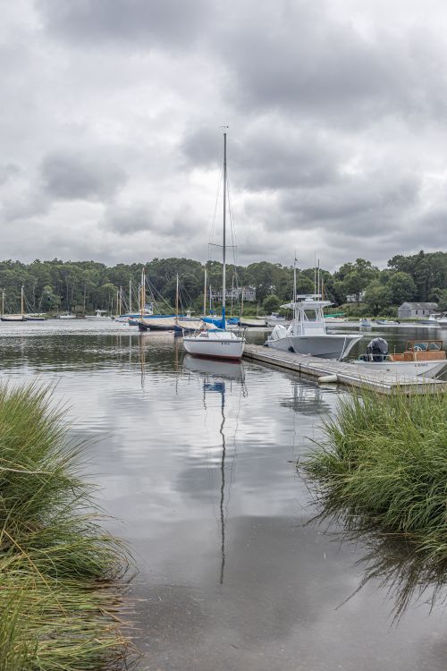 Free Peaceful harbour with sailboats on a cloudy day in Orleans, MA Stock Photo