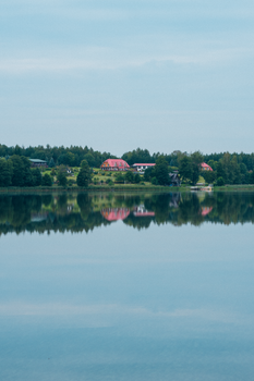 Calm lake reflection of a scenic landscape in Nečiūnai, Vilnius County.