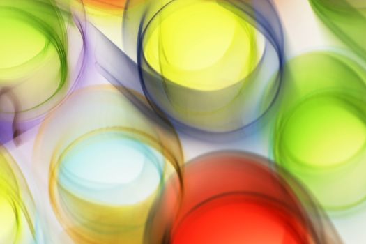 Colorful abstract circles with motion blur create a vibrant, dynamic visual effect.