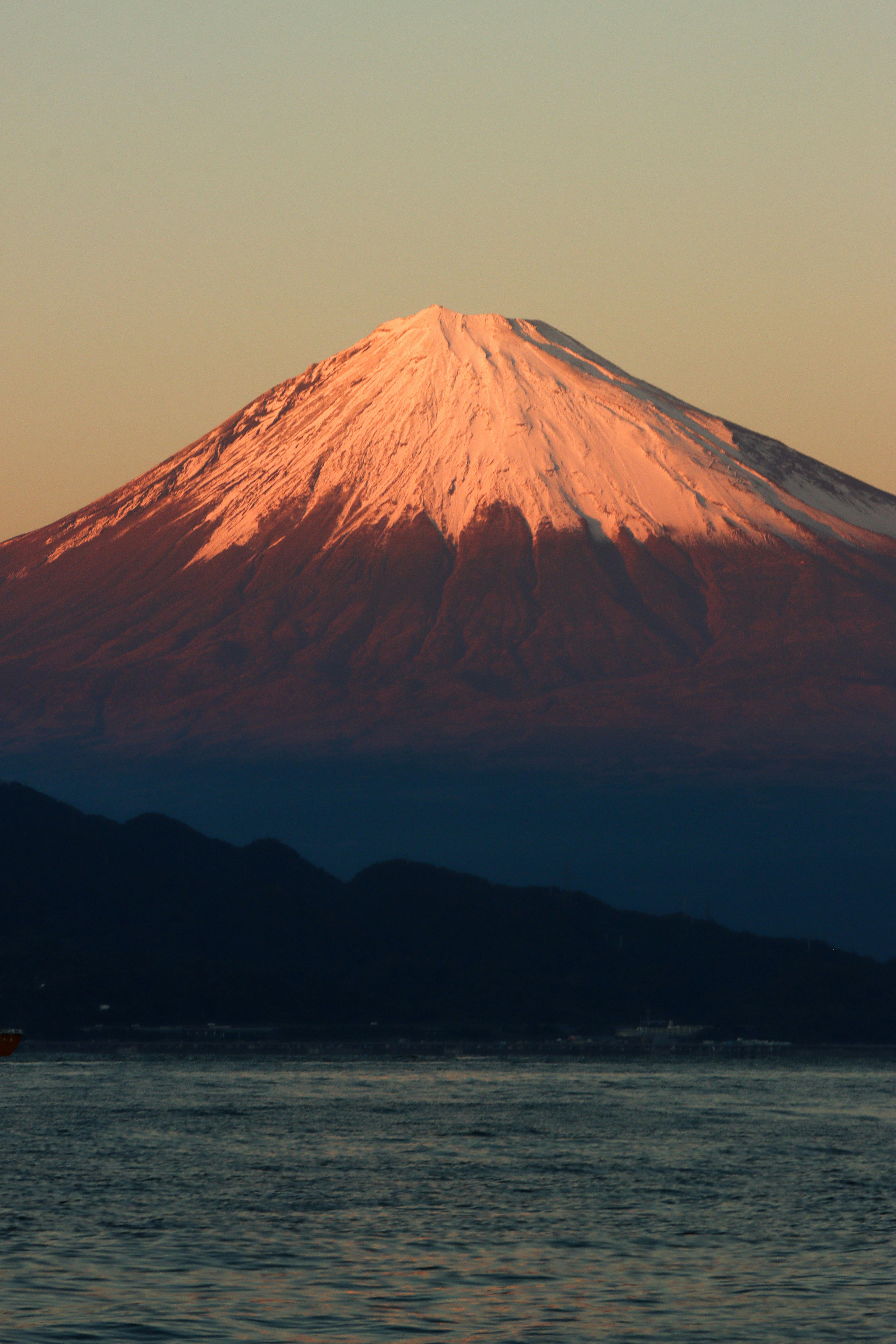 a mountain with a large white peak in the distance