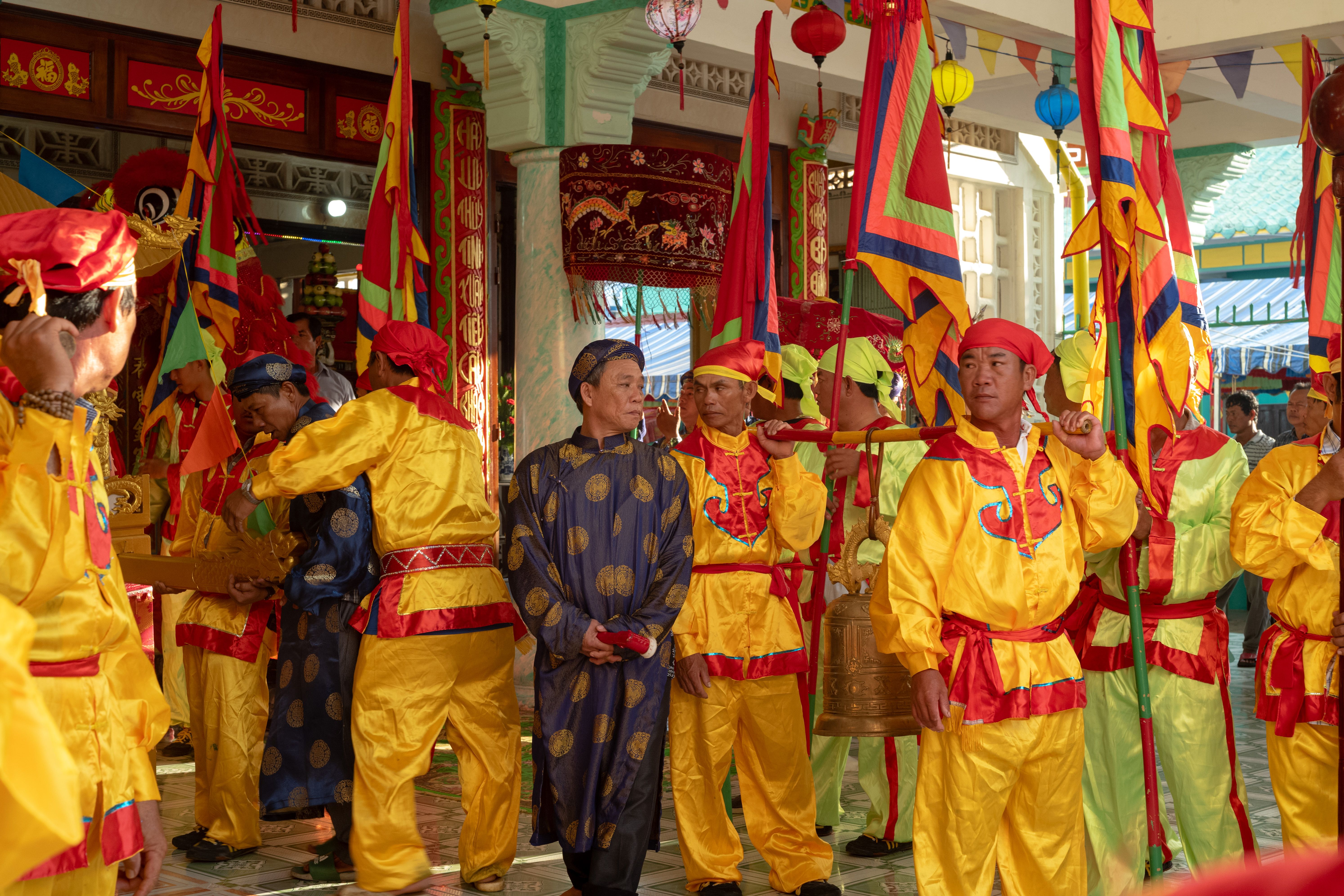 A group of people in colorful costumes standing in a line · Free Stock ...