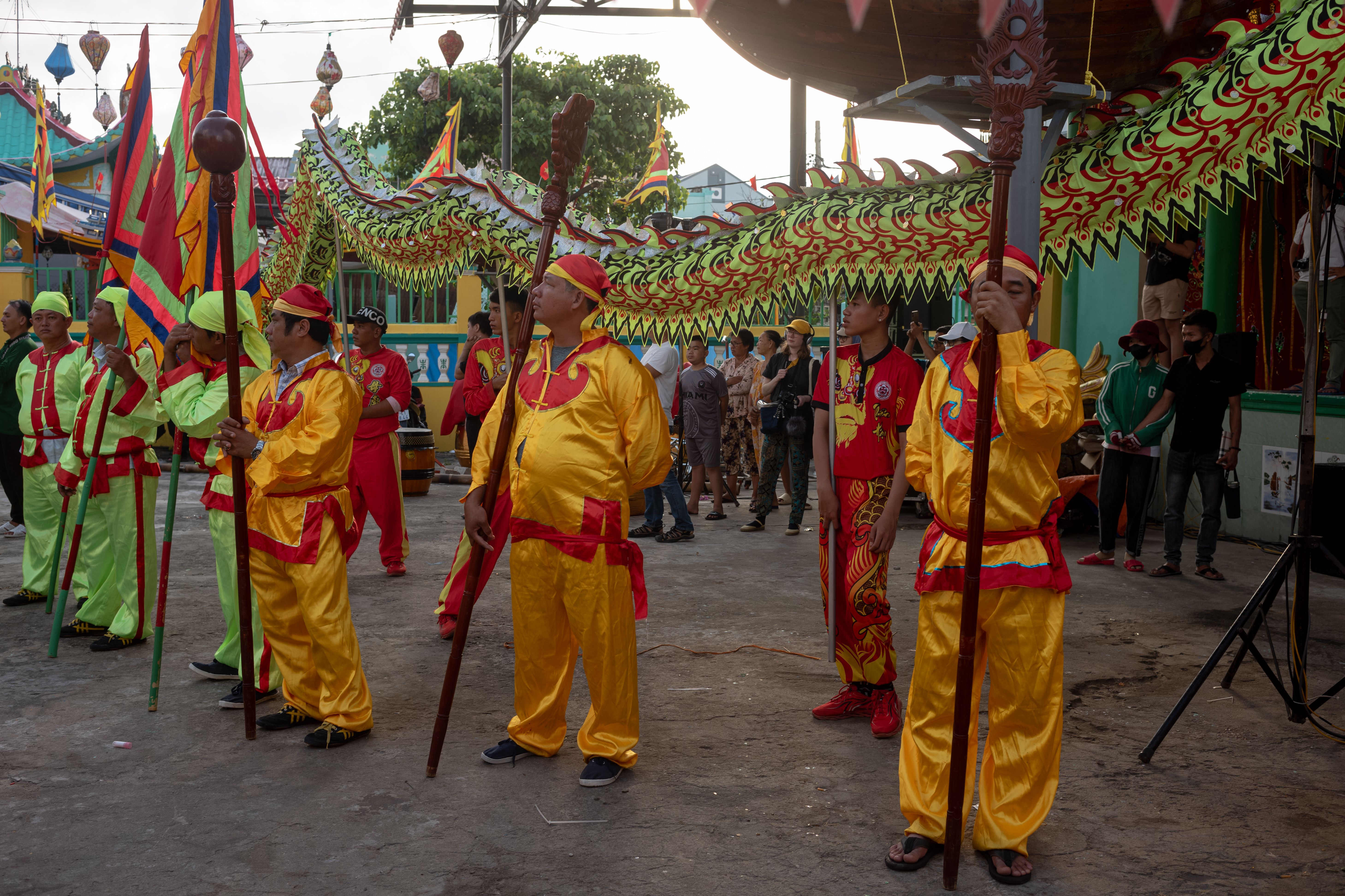 A group of people in yellow and red costumes · Free Stock Photo
