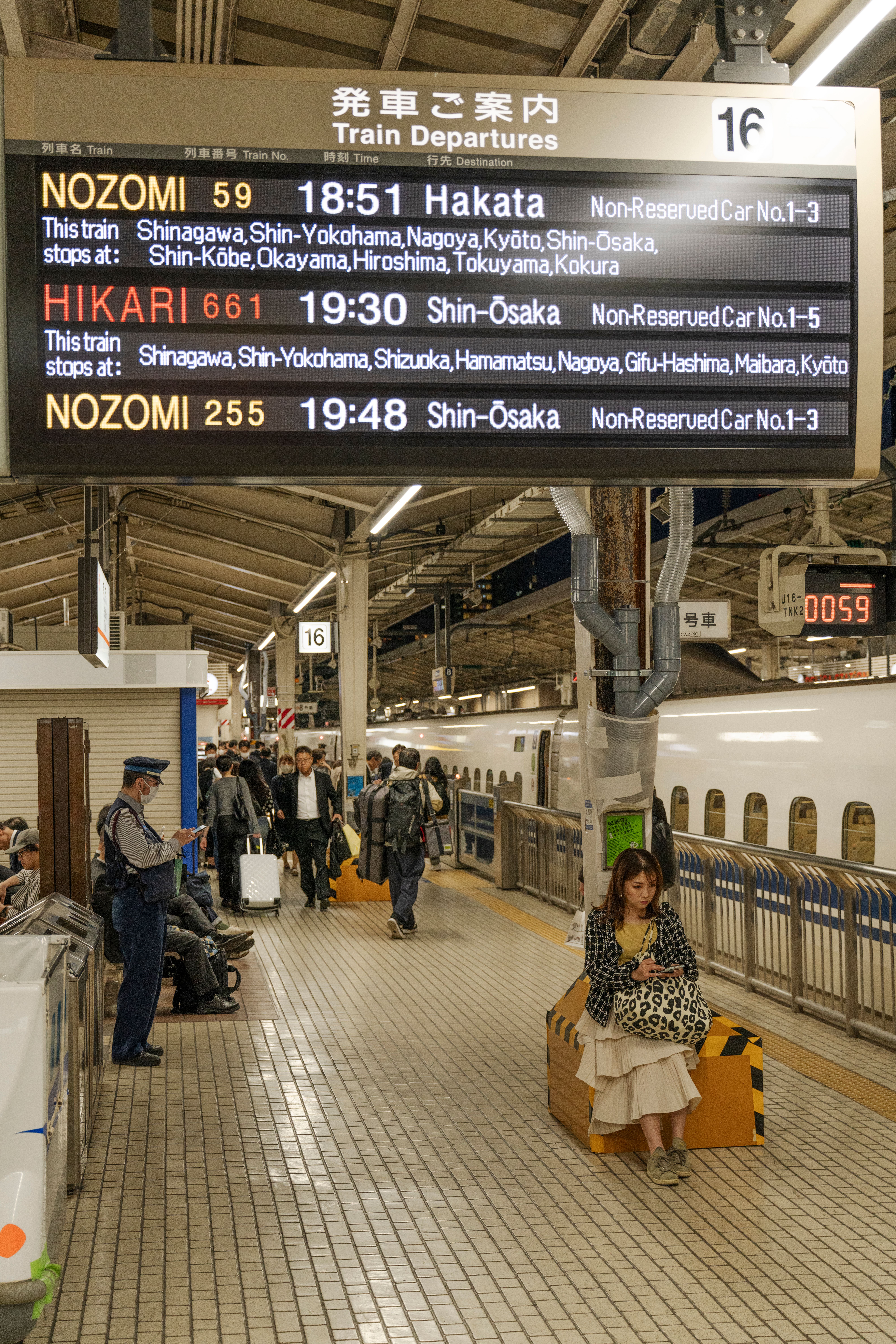 A train station with people waiting for their train · Free Stock Photo