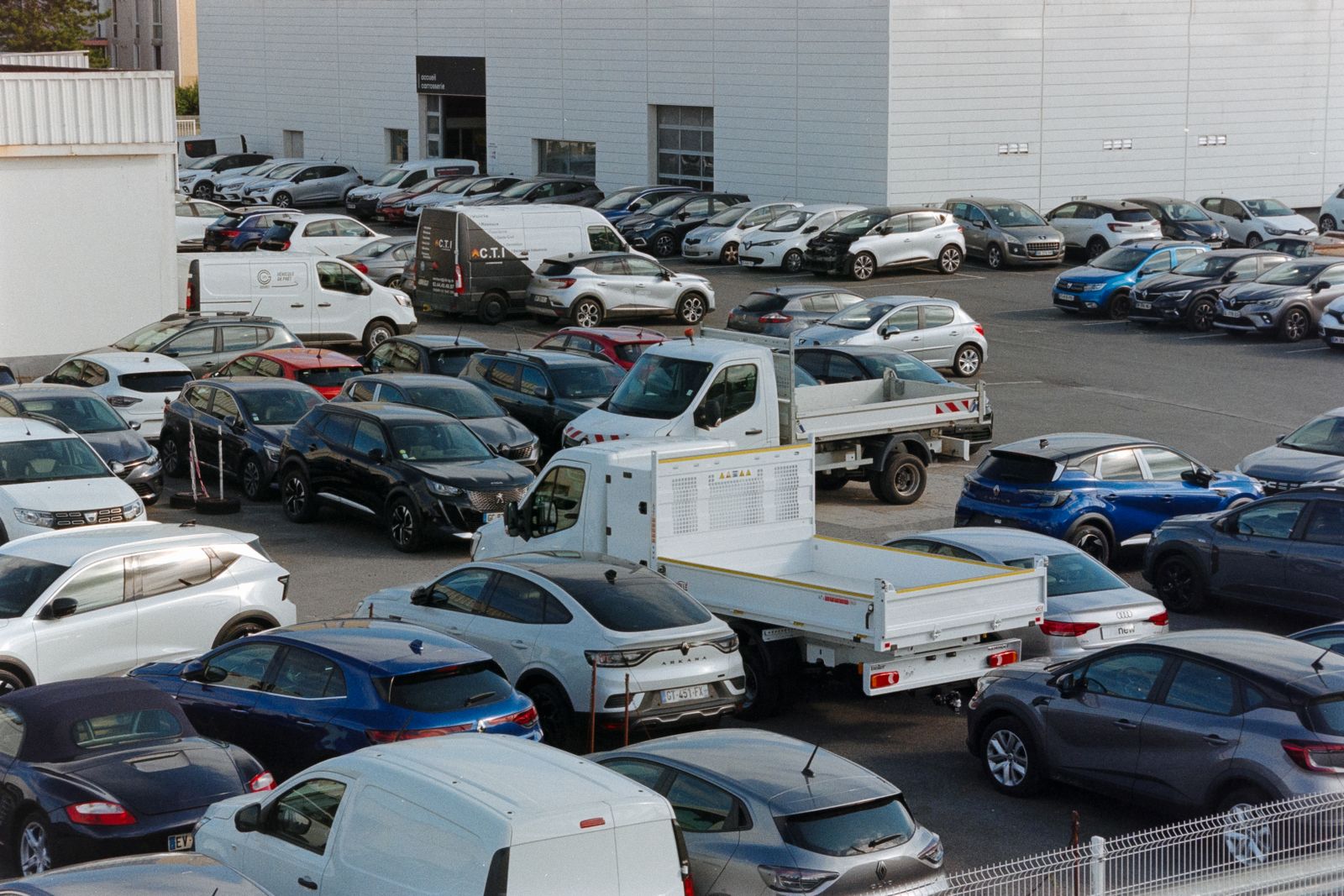 Forecourt with rows of cars