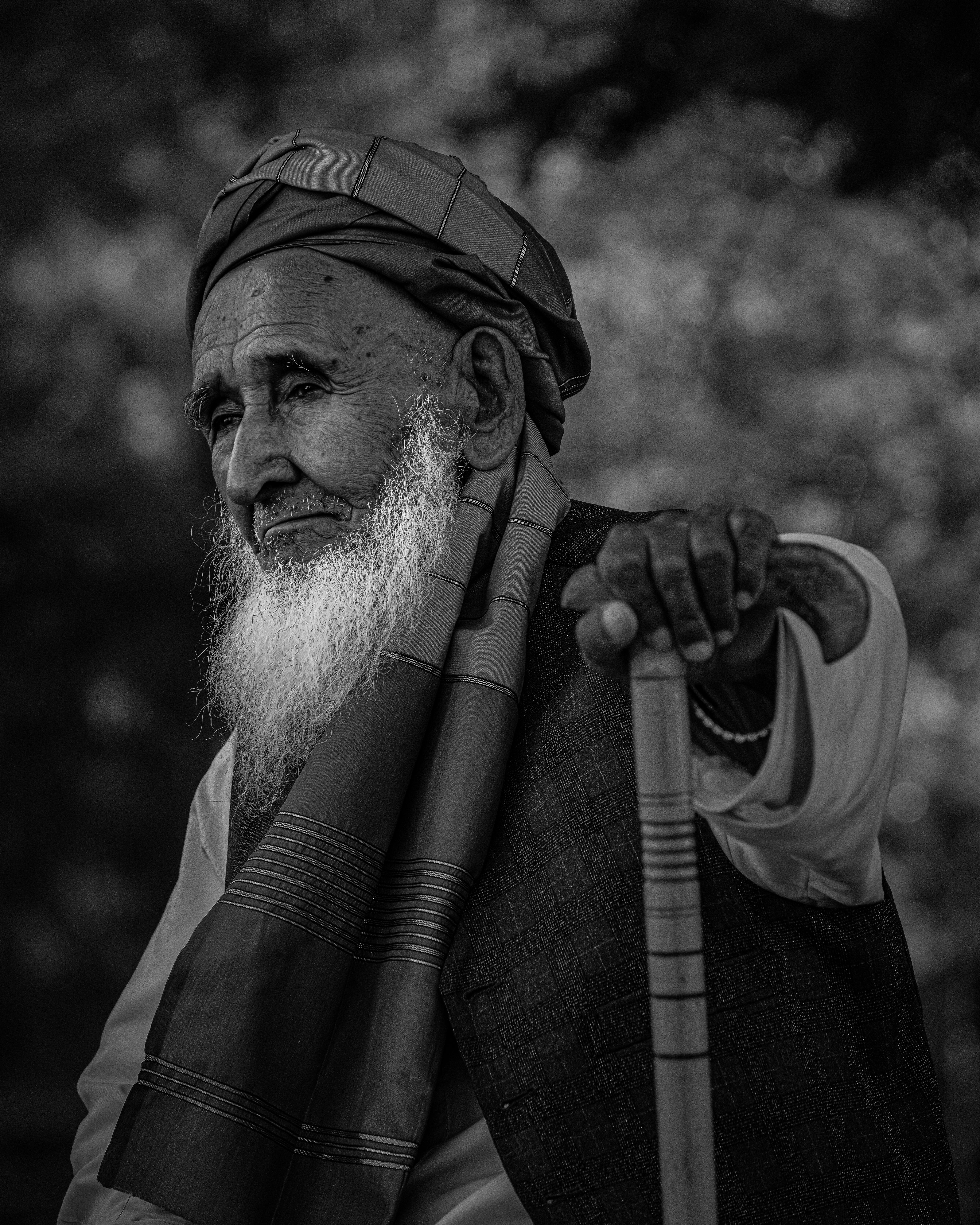 an old man with a long beard and a cane