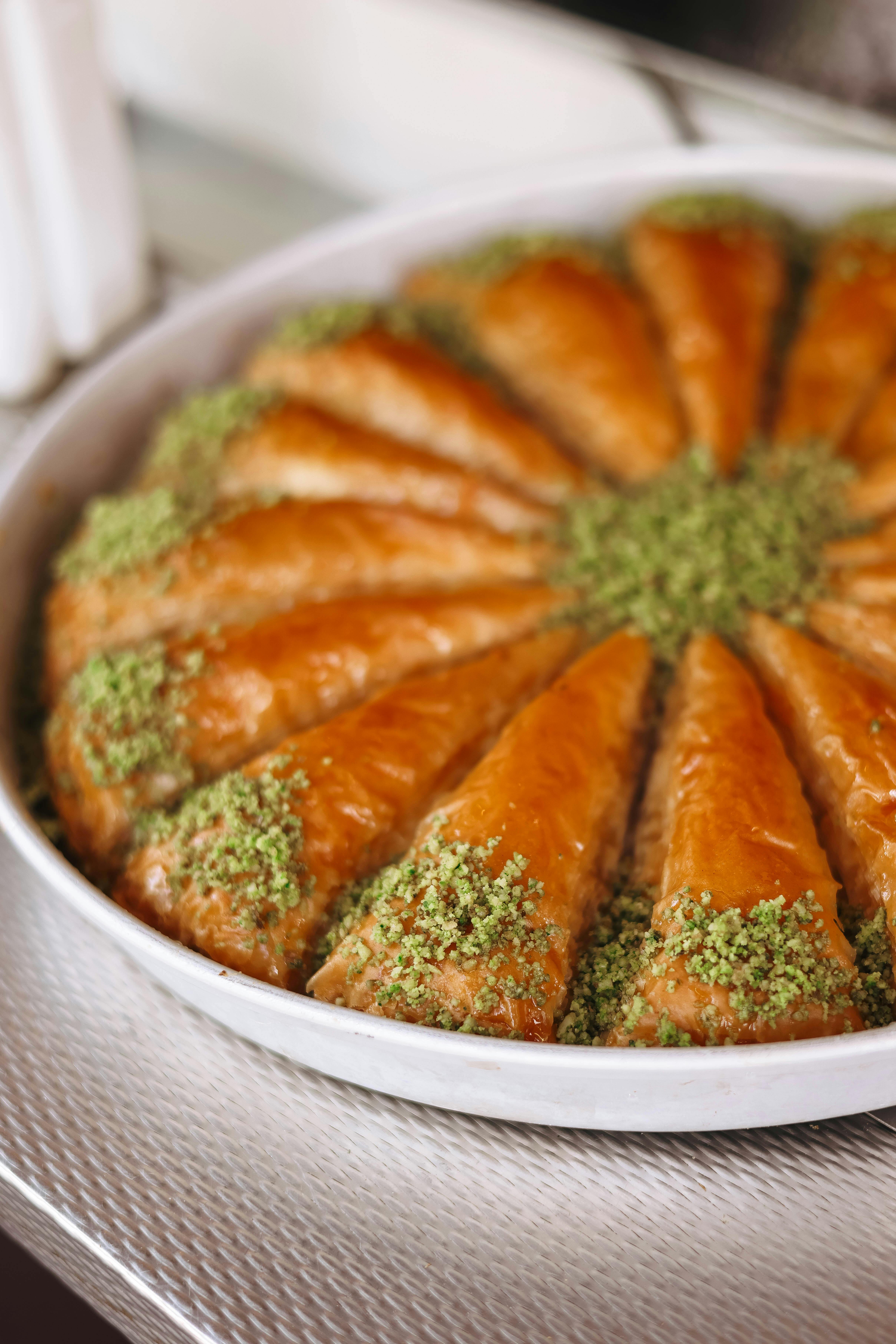 a pastry with green pistachio on top