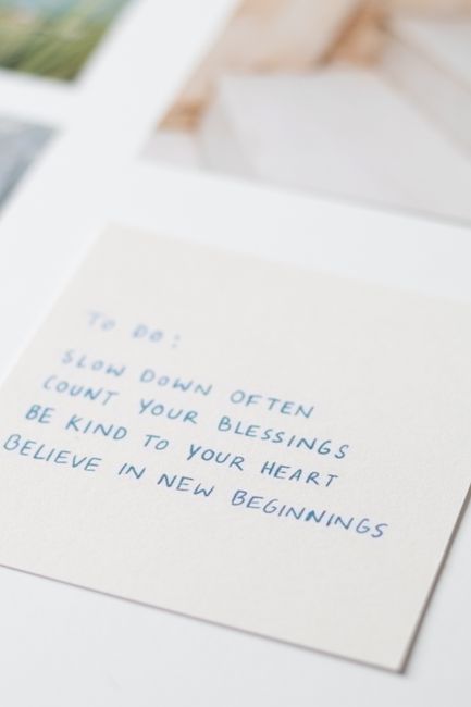 A handwritten note with motivational phrases for mindfulness and positivity.