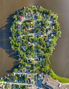 Stunning aerial view of a peninsula neighborhood in Albert Lea, MN, surrounded by water.