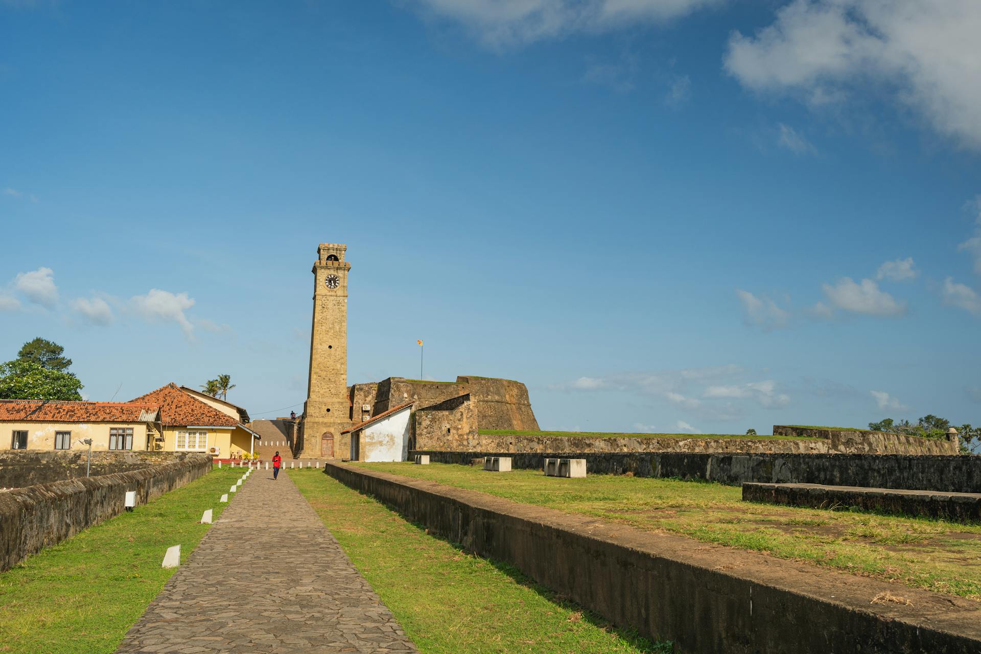 A stunning view of Galle Fort in Sri Lanka, featuring historic architecture and vibrant summer skies.