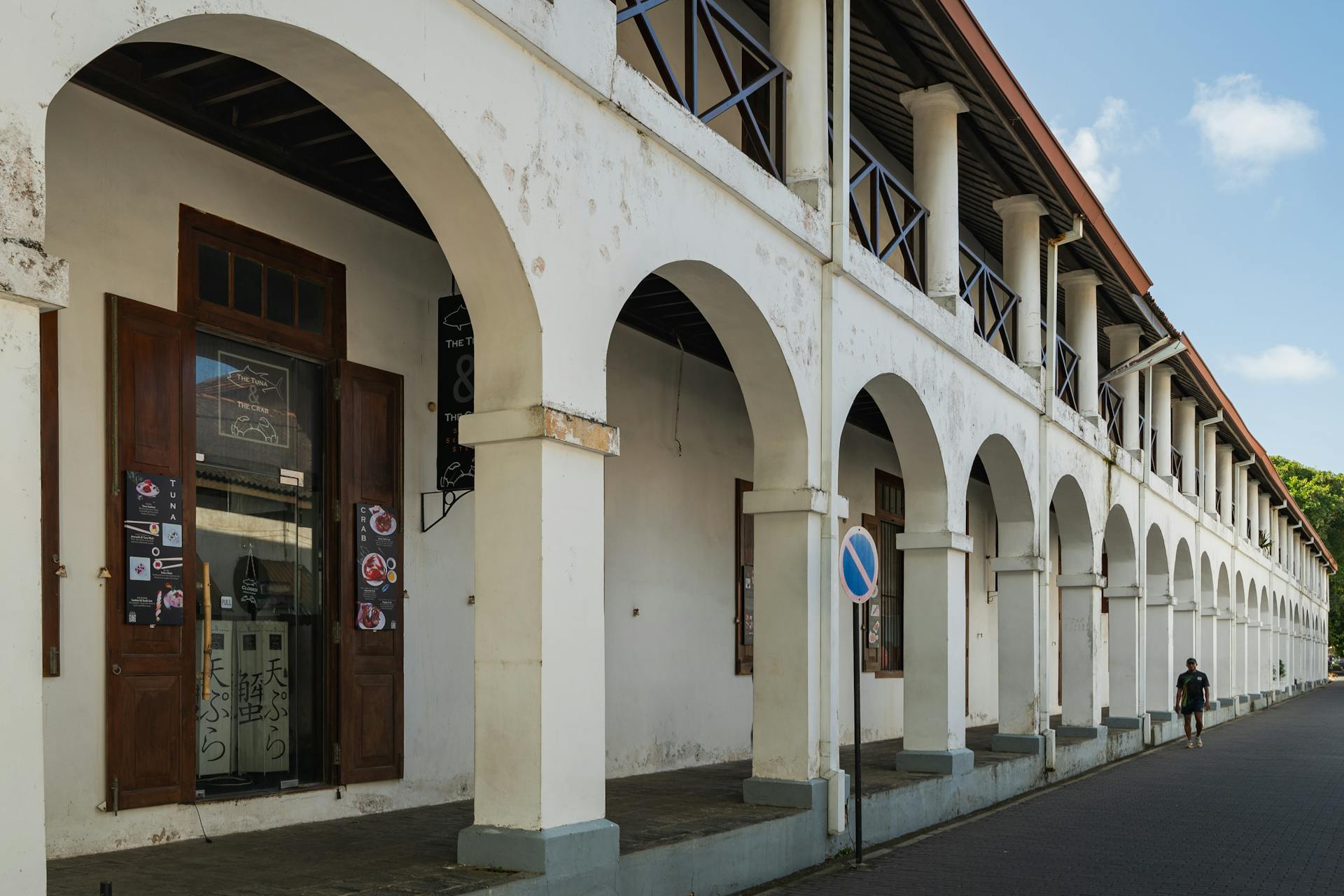 Historic colonial building with arches in Galle Fort, showcasing architectural heritage of Sri Lanka.