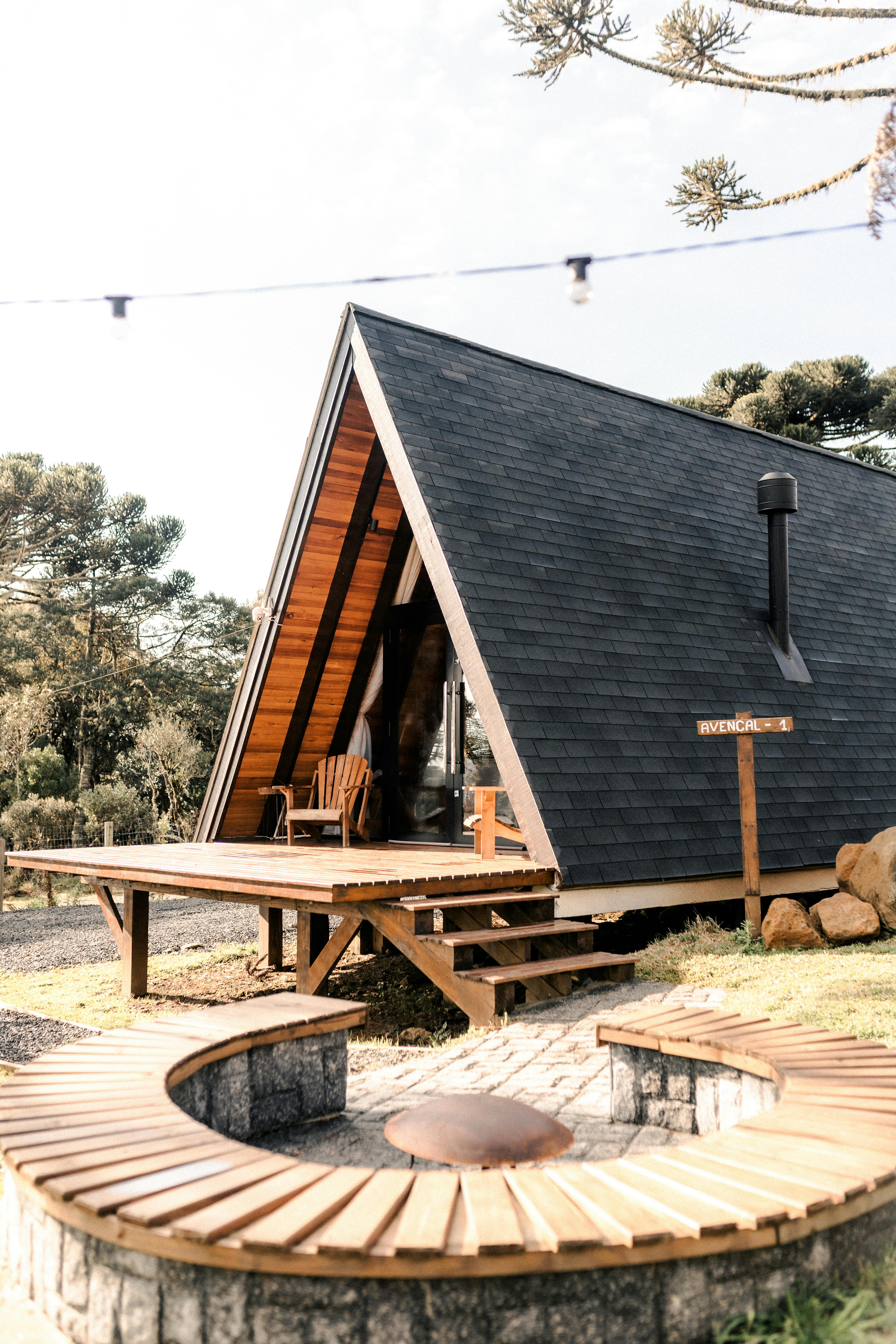 a small cabin with a fire pit in the middle