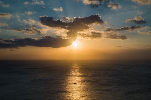 Beautiful sunset with sunbeams over the sea in Pingtung, Taiwan, capturing natural tranquility.