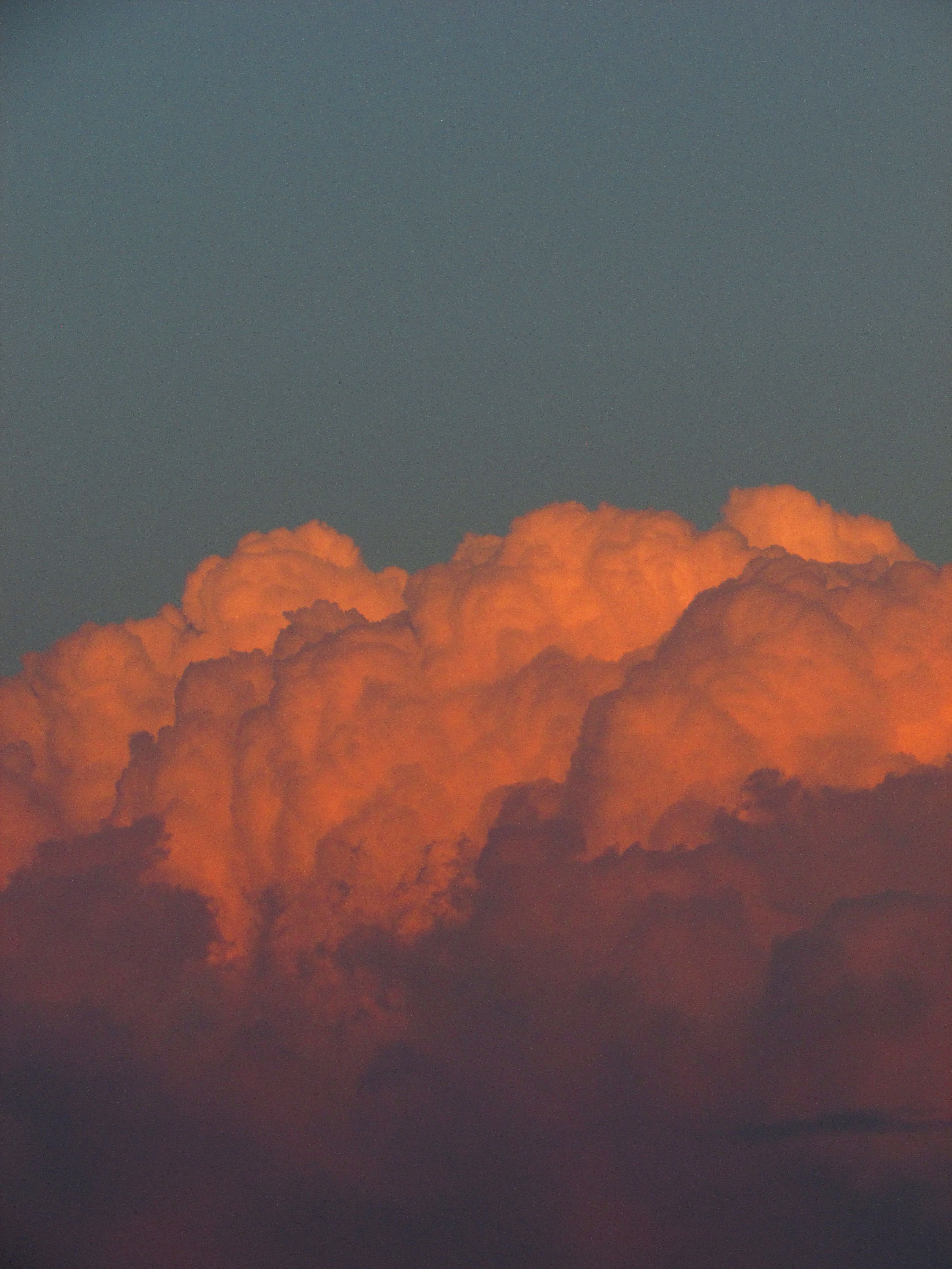 Stunning sunset clouds display vibrant colors in a dramatic sky.