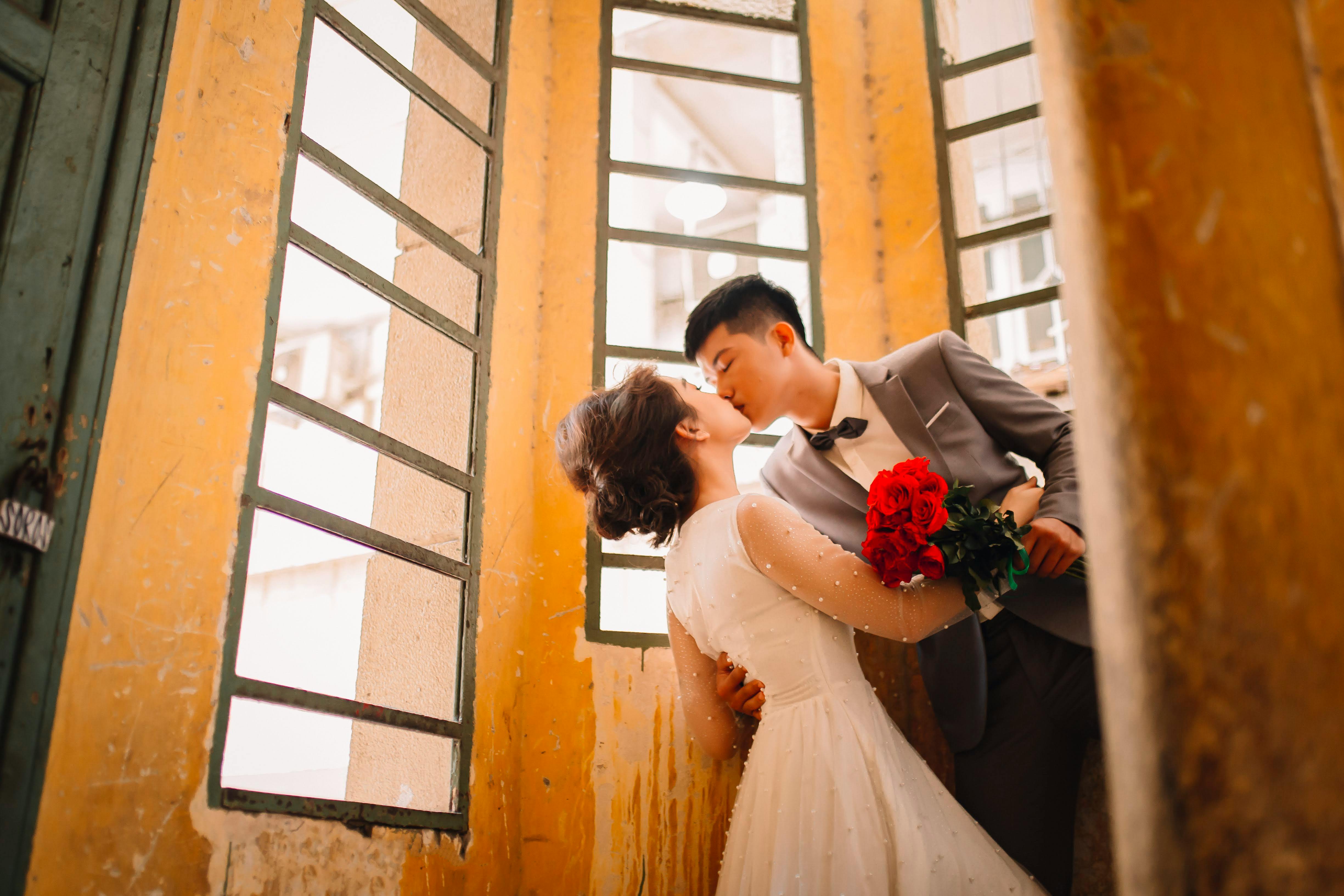 wedding couple kissing in church