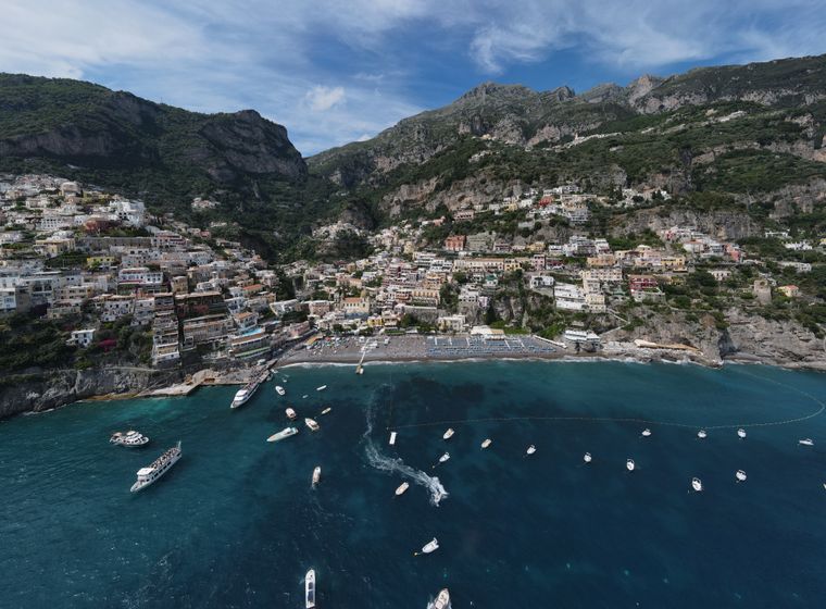 Aerial view of Positano's cliffs and turquoise water