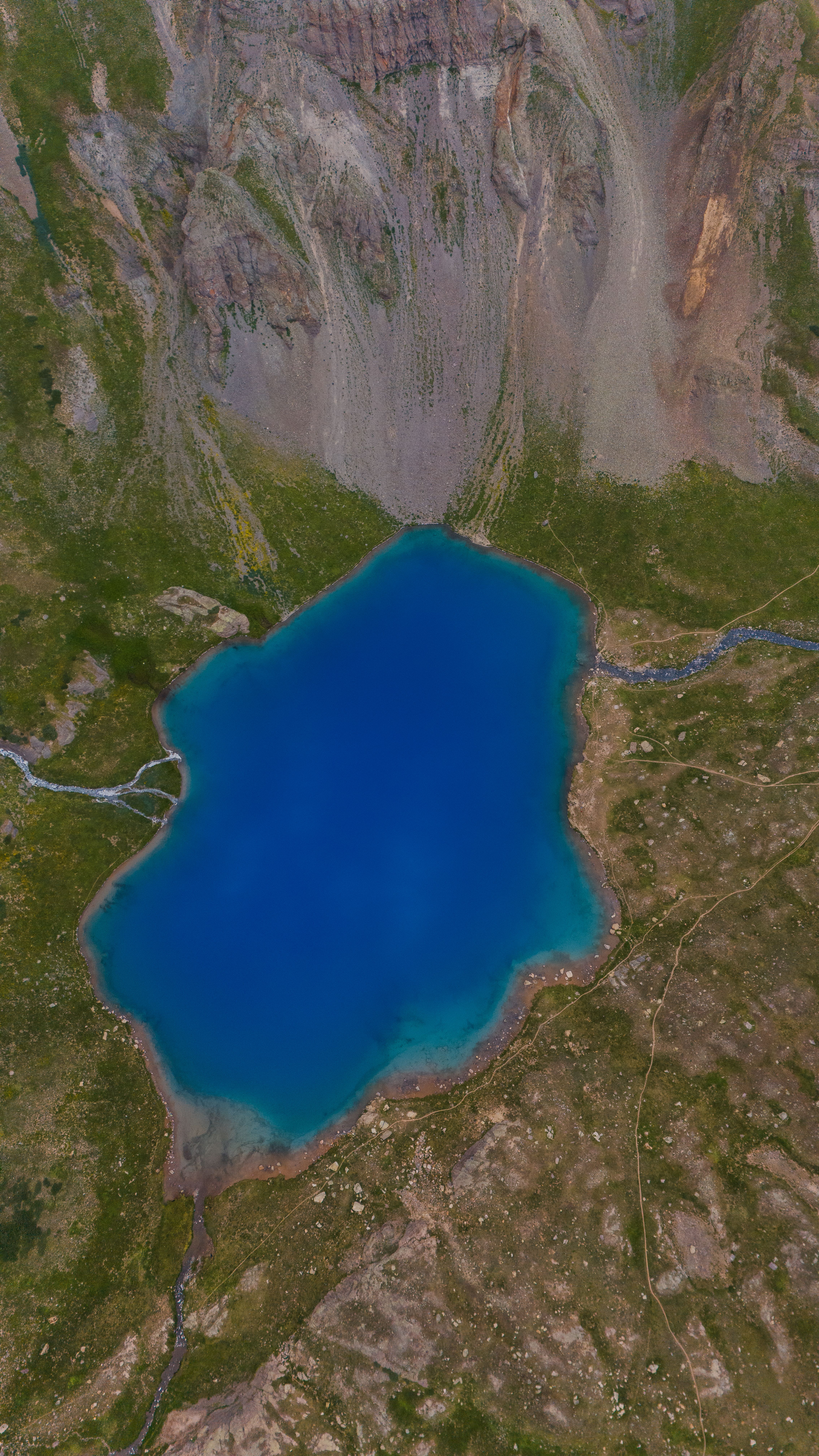 A blue lake is shown in this satellite image · Free Stock Photo