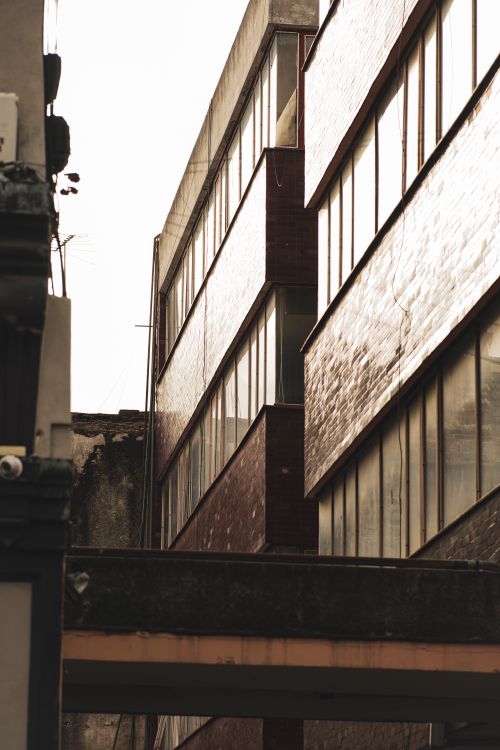 Free Dramatic view of urban architecture highlighting geometric lines and textures. Stock Photo