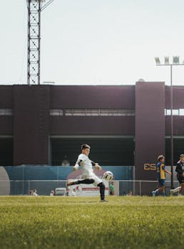 Dynamic shot of a soccer player kicking a ball on a field in Guadalajara, Mexico.