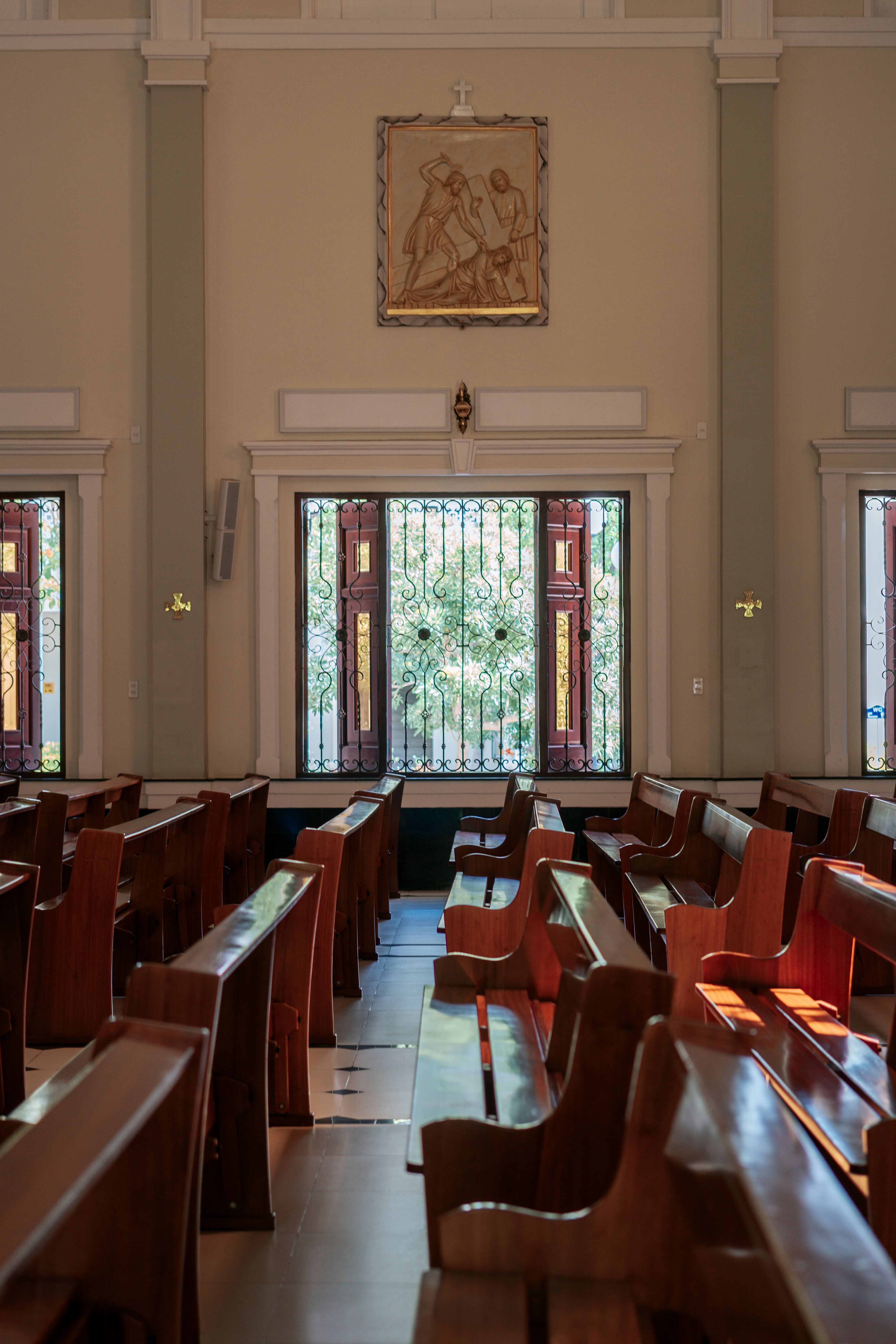 Peaceful church sanctuary with wooden pews and stained glass