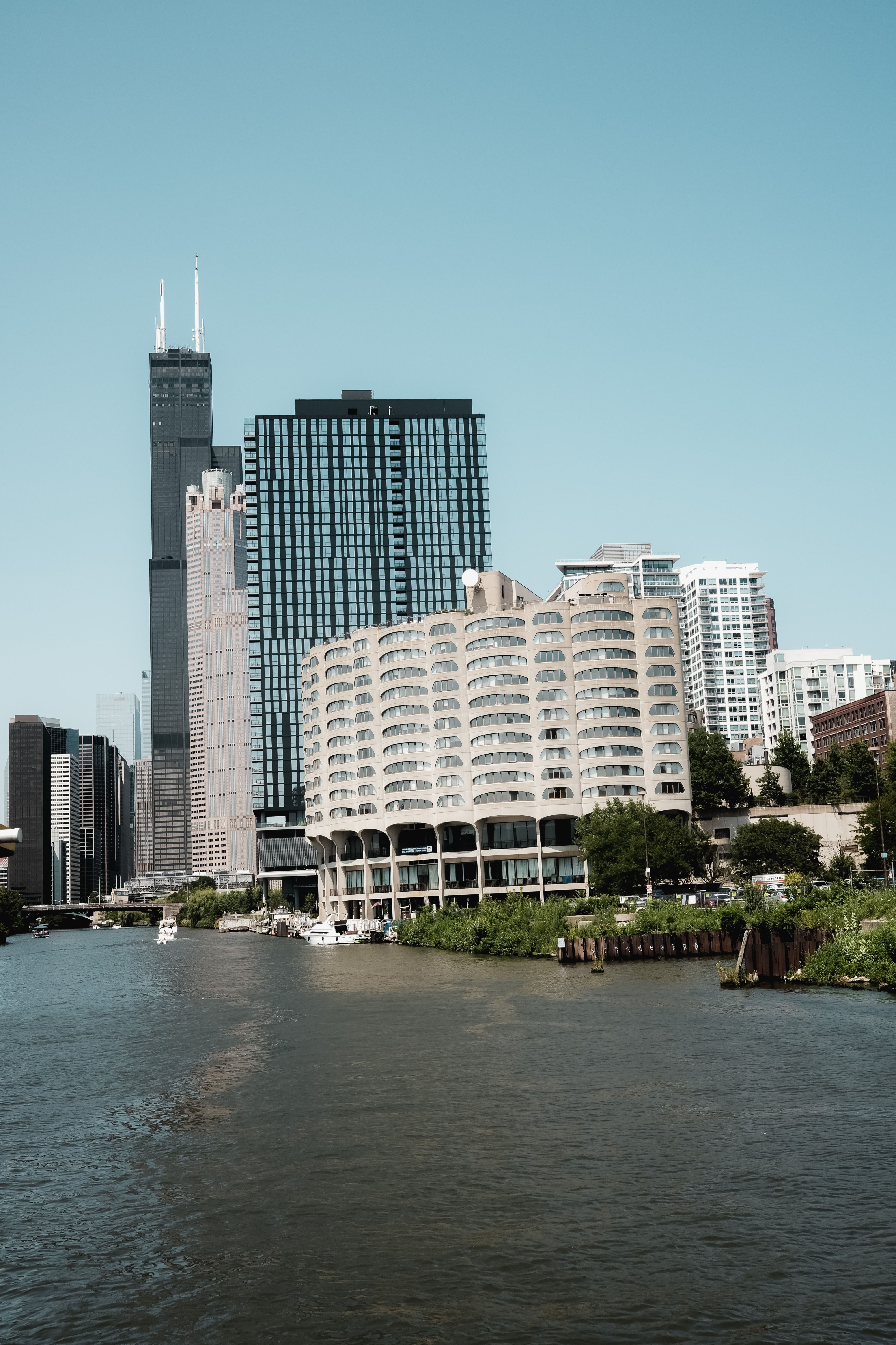 A river with tall buildings in the background · Free Stock Photo