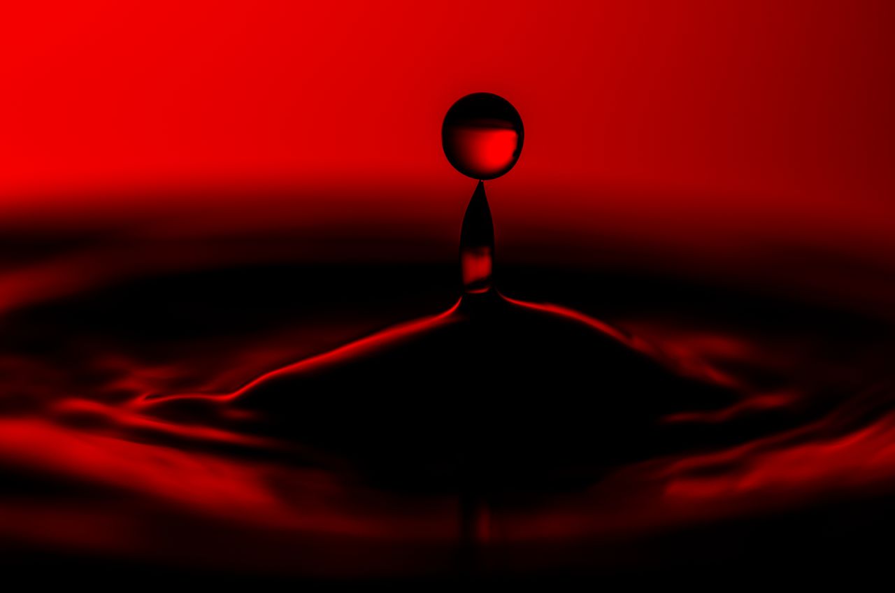 close up image capturing the dramatic splash of a water drop on a vivi