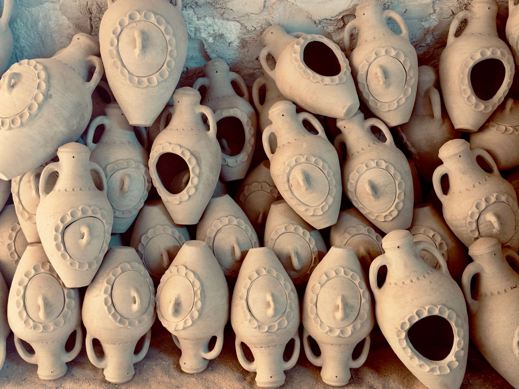 Collection of handcrafted clay jugs in Médenine, Tunisia, showcasing traditional pottery art.
