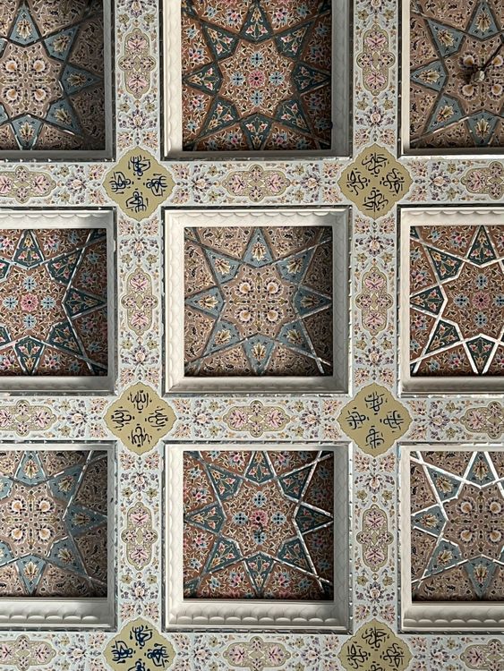 A decorative ceiling with geometric patterns and stars · Free Stock Photo