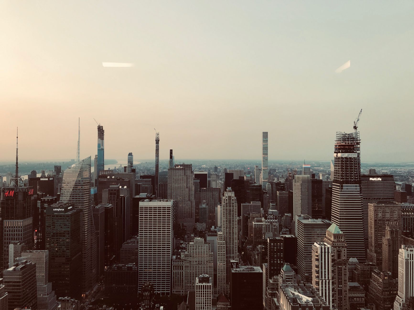 A breathtaking aerial shot of New York City's iconic skyline featuring skyscrapers under a clear sky.